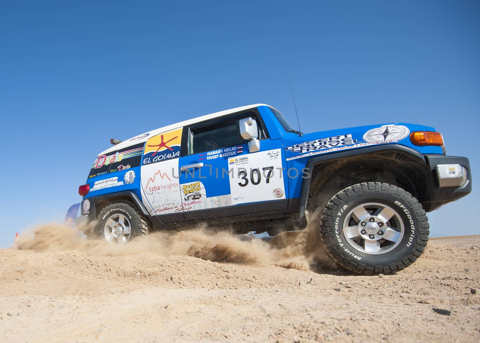 Off-road trucks competing in a desert rally by paulvinten