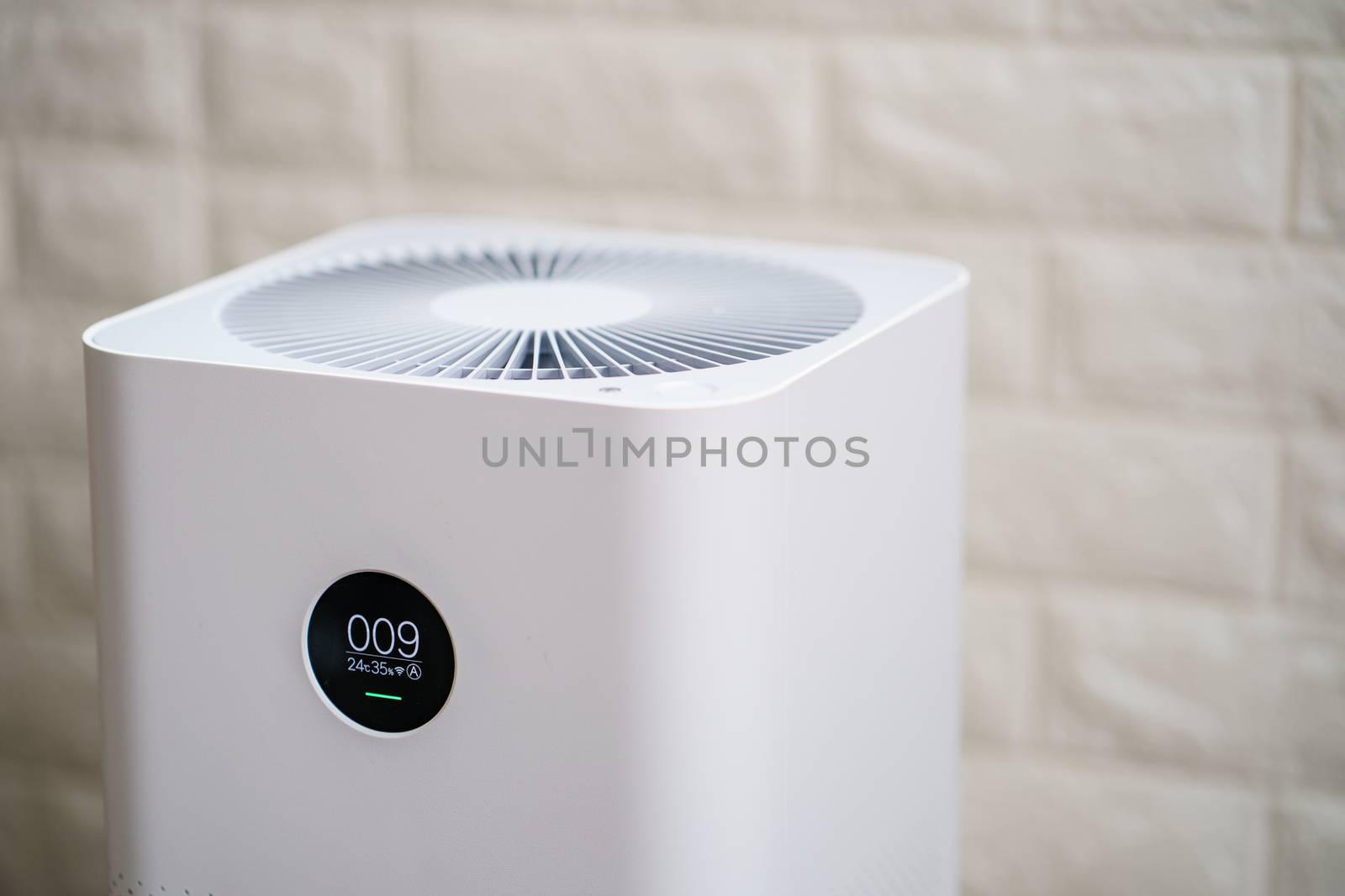 Closeup of Air purifier with monitor screen, show air quality in the room. PM2.5 concept.