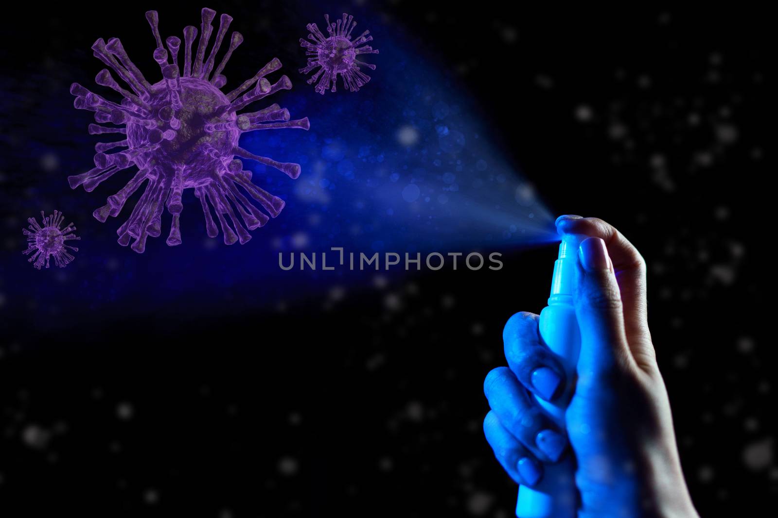 Hand using sanitizer spray, alcohol spraying disinfectant to stop spreading coronavirus or COVID-19.