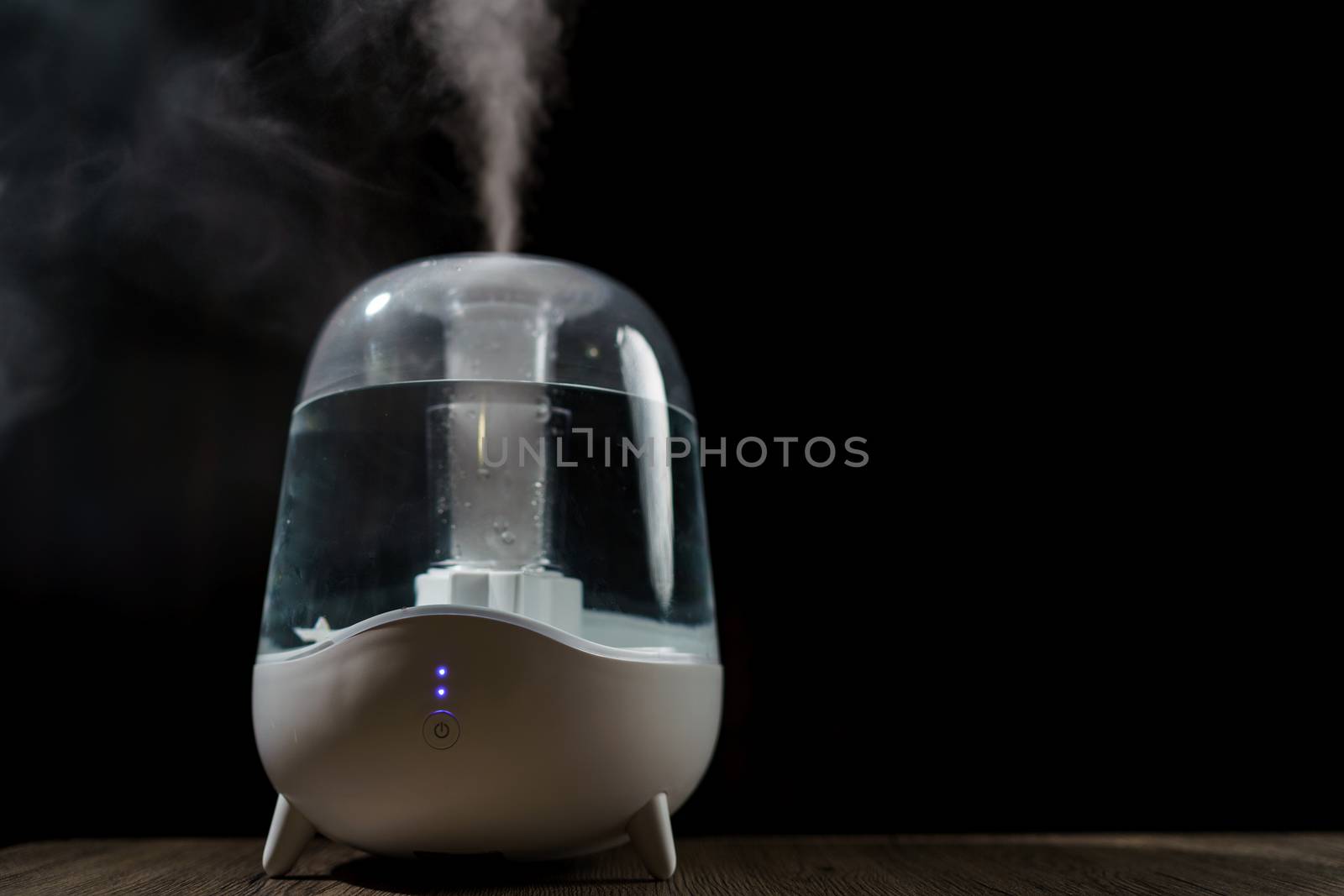 Aroma oil diffuser or air humidifier, increase in air humidity indoors.