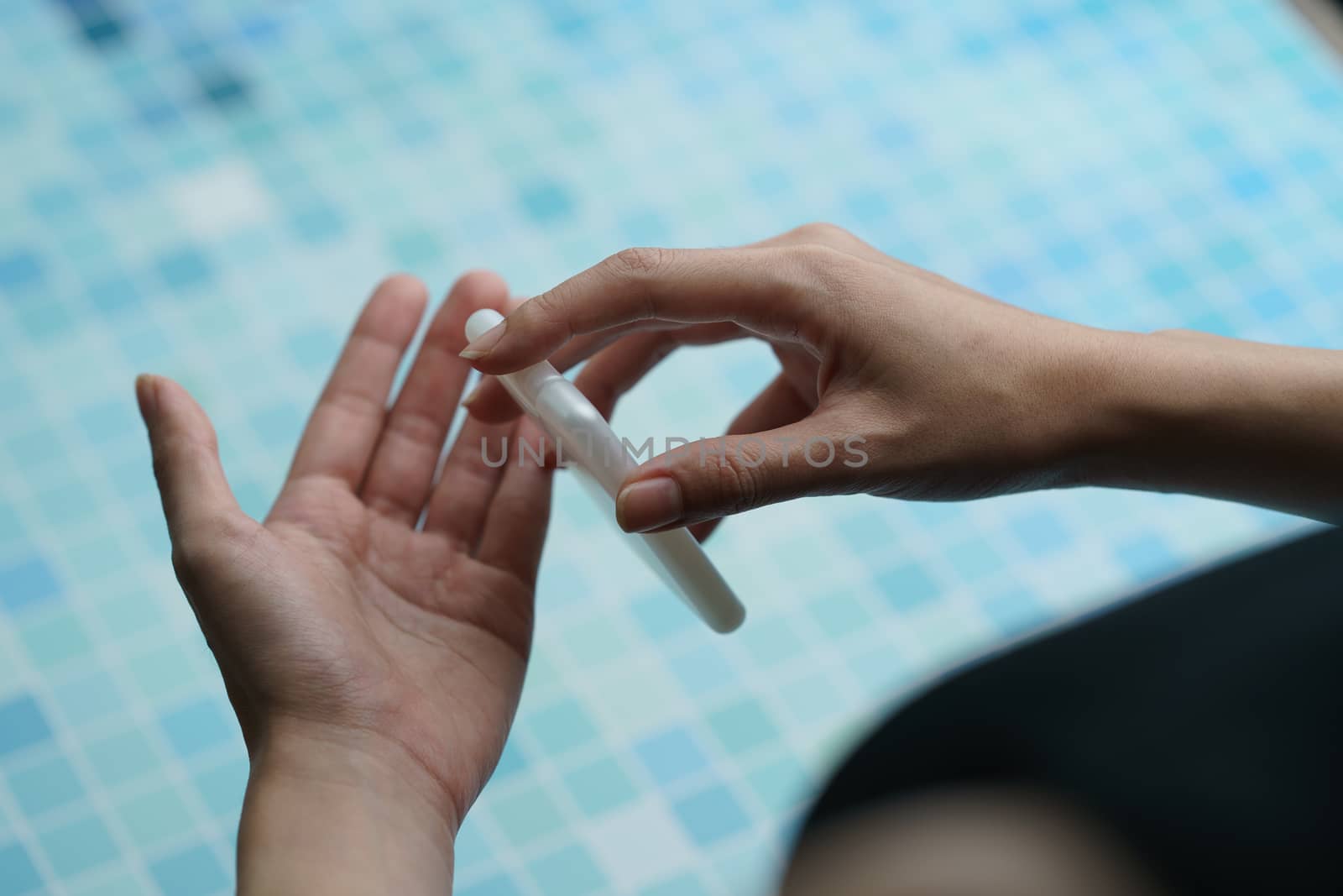 Close up woman using antibacterial hand sanitizer on hands. by sirawit99