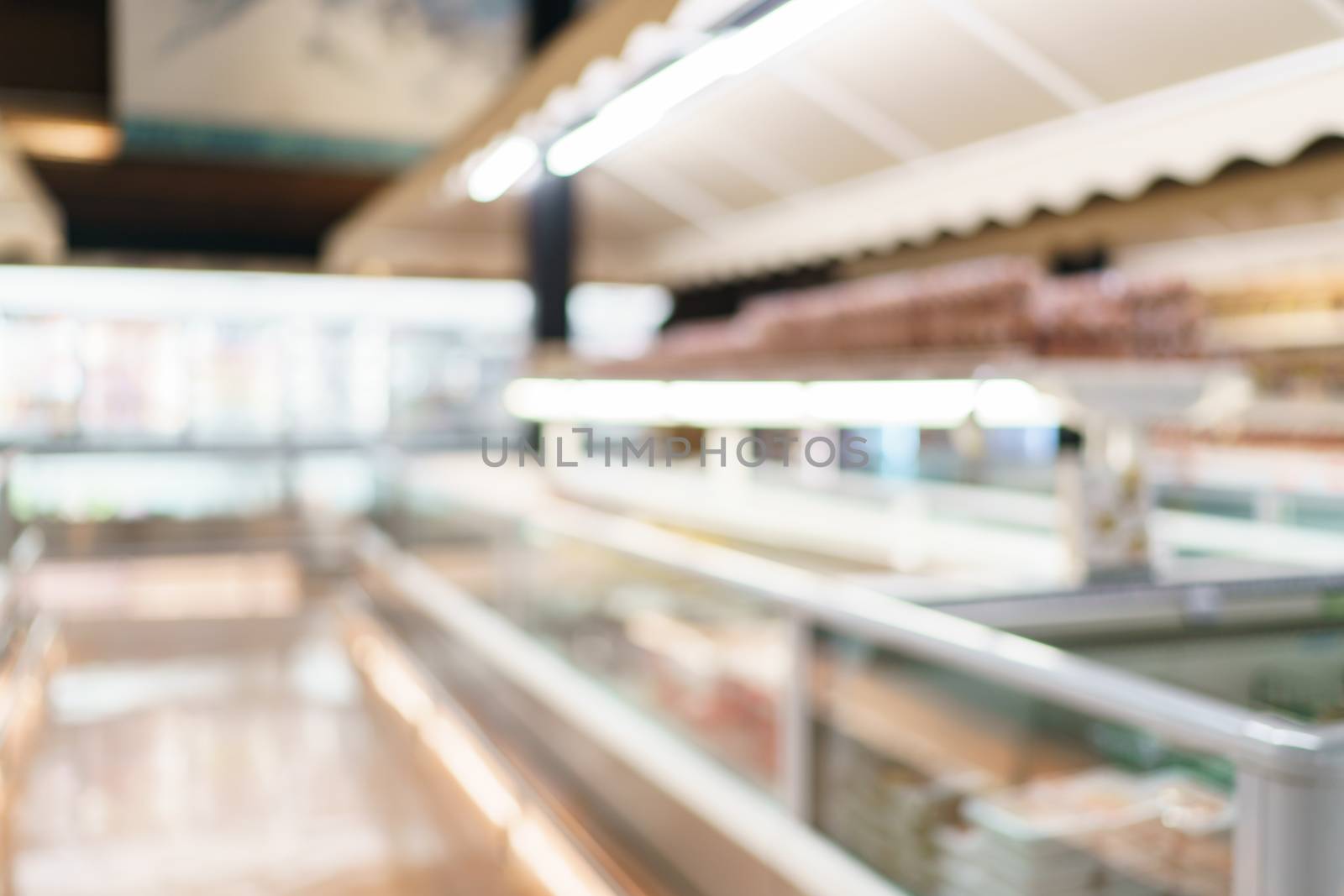 Blurred of supermarket with product shelves background image. by sirawit99