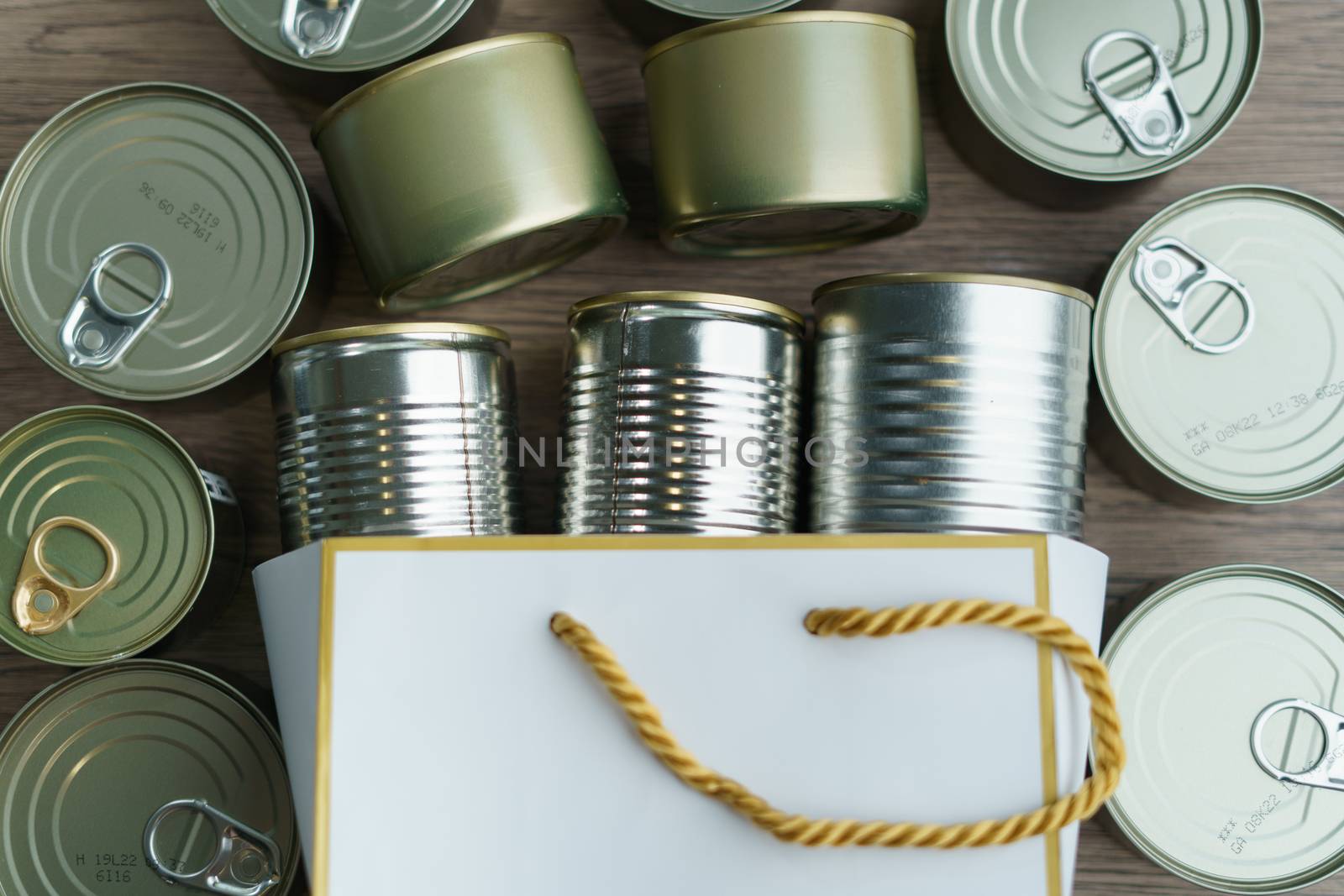 Canned food in shopping bag with group of Aluminium canned food.