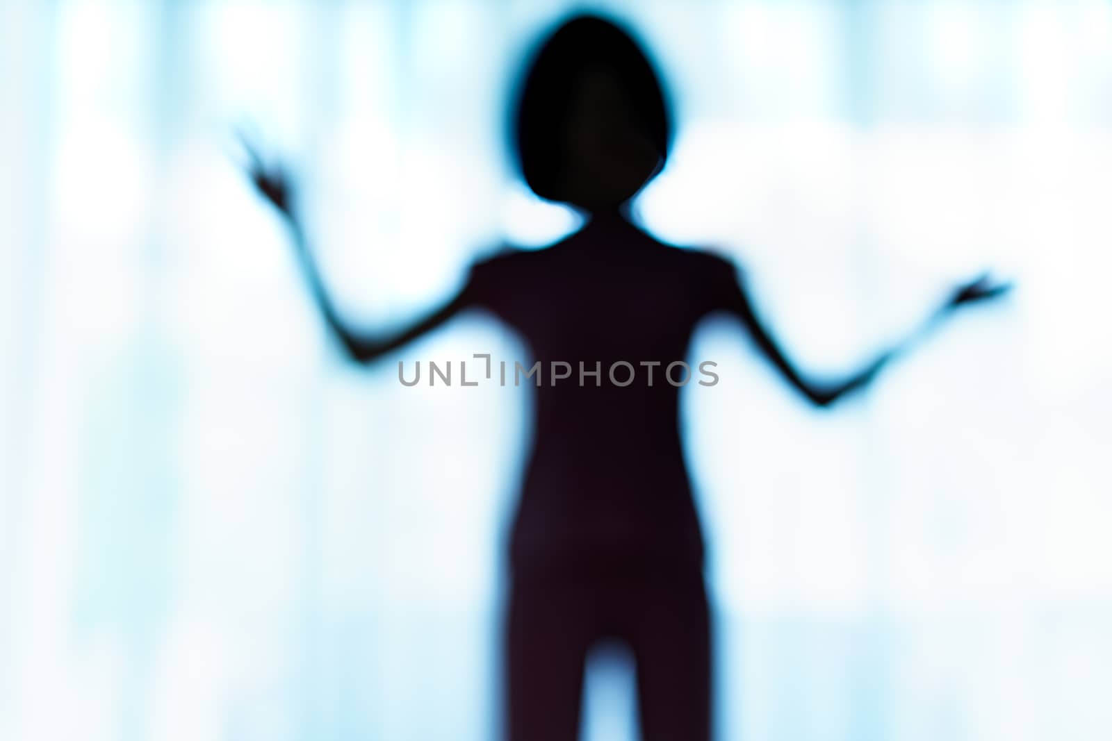 Blurred silhouette of human body look like alien. by sirawit99