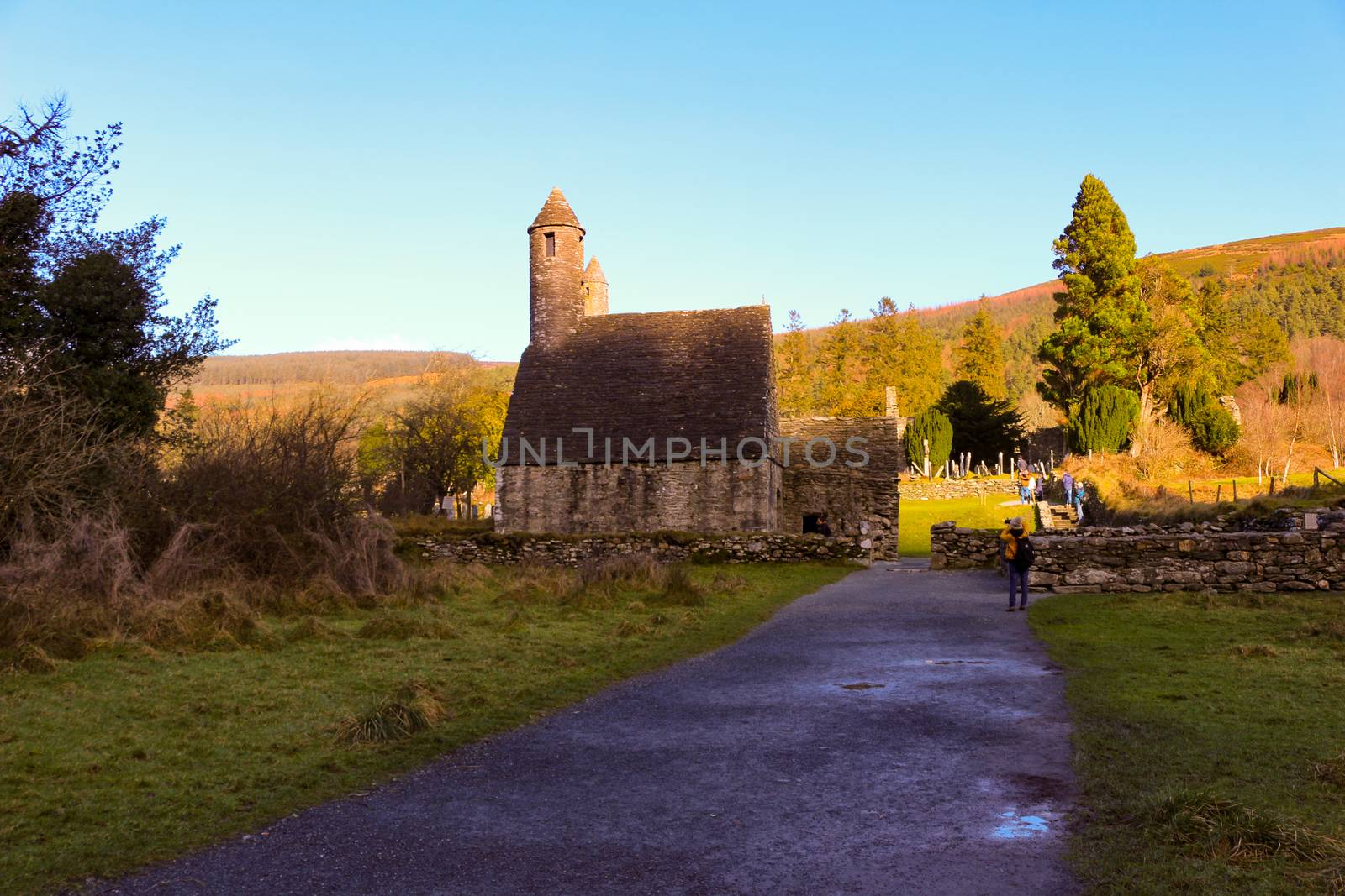 GLENDALOUGH, IRELAND - February 20 2018: The ancient cemetery in monastic site Glendalough. Glendalough Valley, Wicklow Mountains National Park, Ireland. Glendalough is home to one of the most important monastic sites in Ireland. This early Christian monastic settlement was founded by St. Kevin in the 6th century and from this developed the 'Monastic City'.