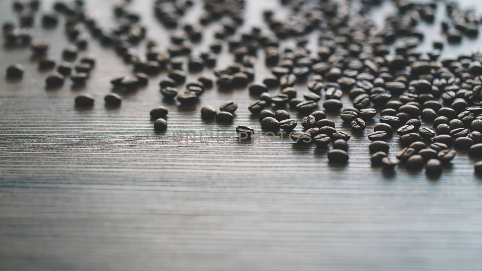 Coffee beans. On a wooden background. by sirawit99