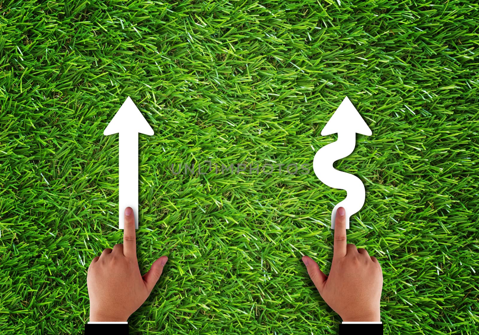 Business alignment concept, strategy and planning, hand and arrow on green grass background