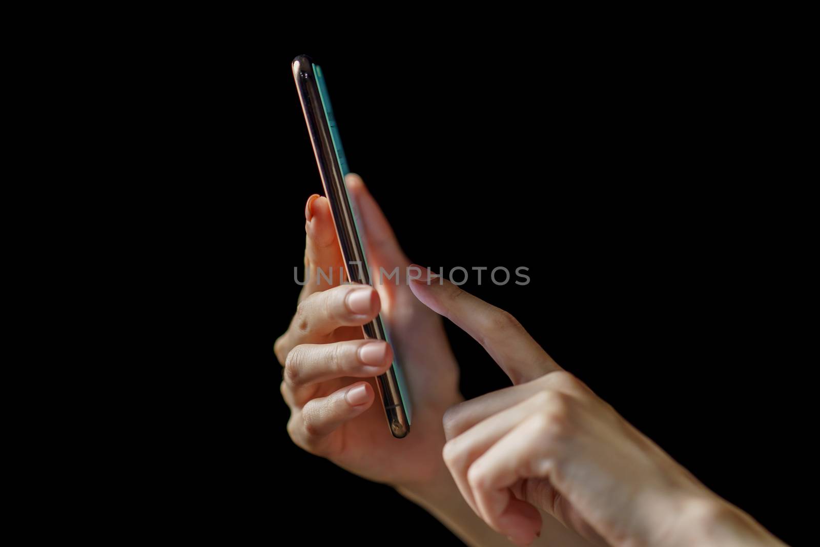 Woman hand holding smartphone. Payment or play.