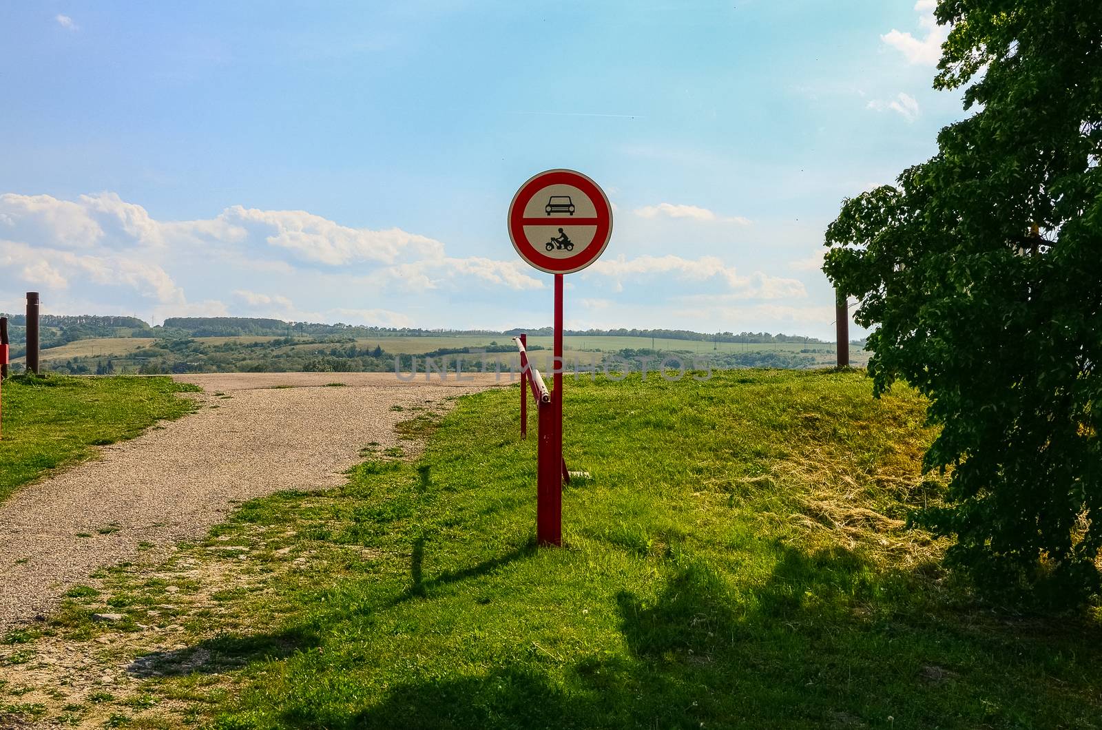 road sign no power-driven vehicles with red boom barrier in Slovakia