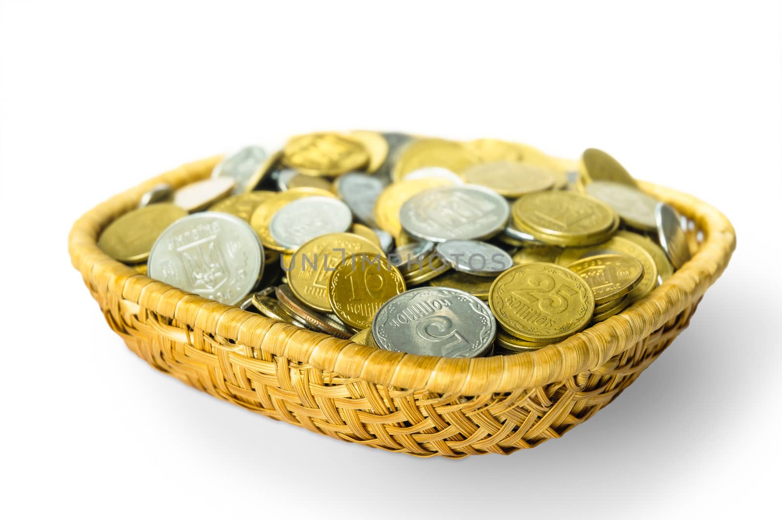 Many ukrainian kopeks, hryvnia cents, in a little basket, isolated on white background