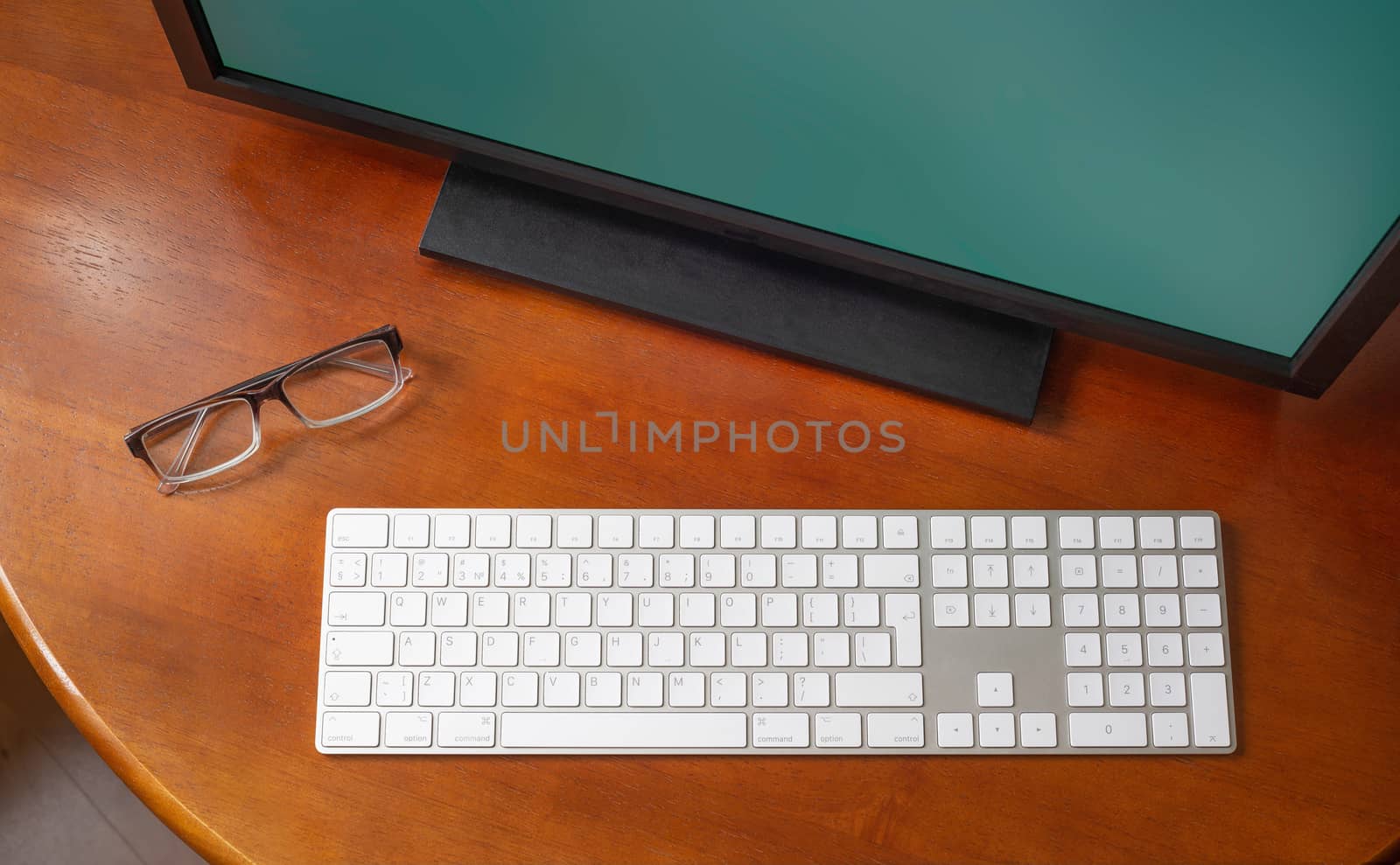 Computer and Eyeglasses on the Desk by MaxalTamor