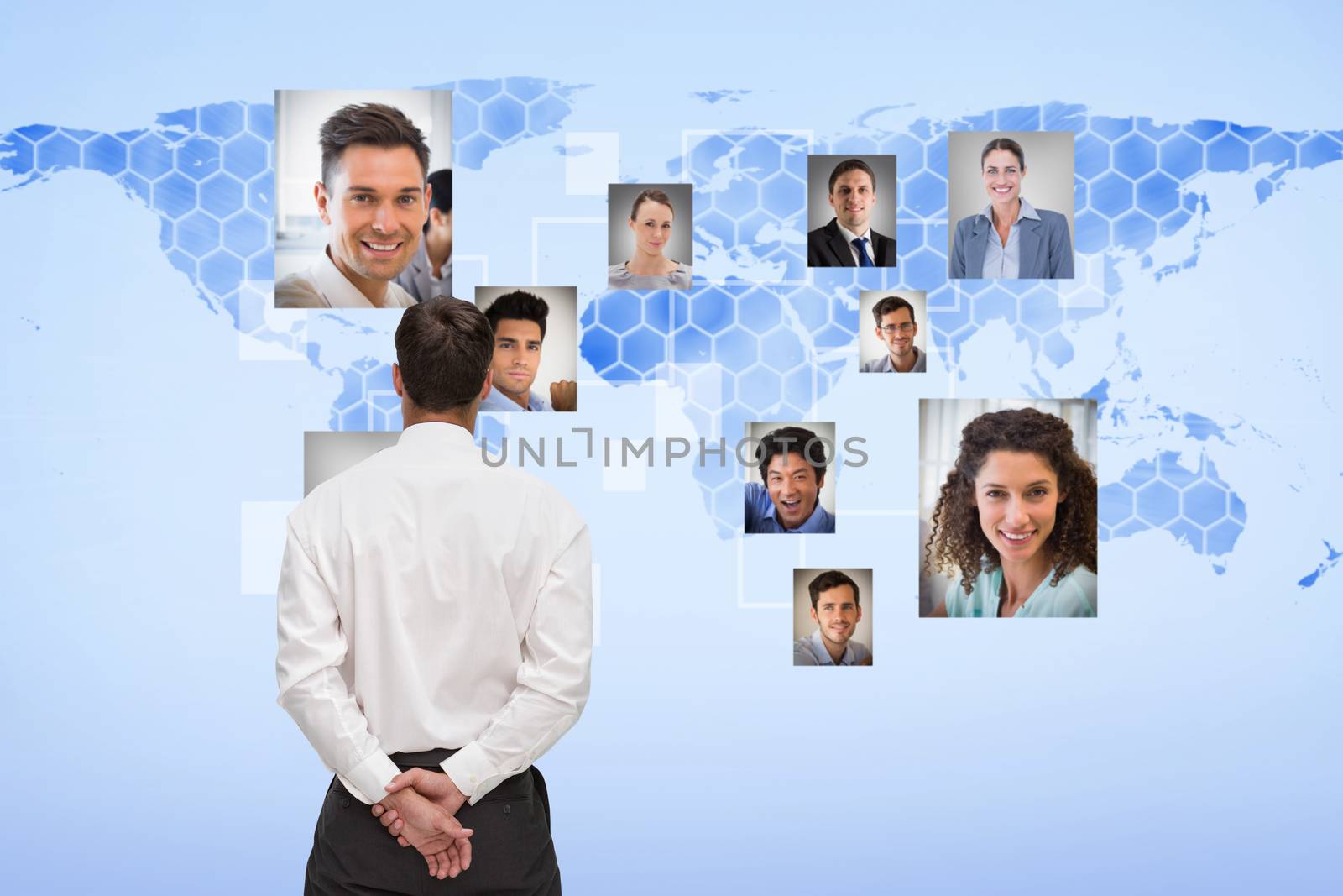 Businessman turning his back to camera against background with world map