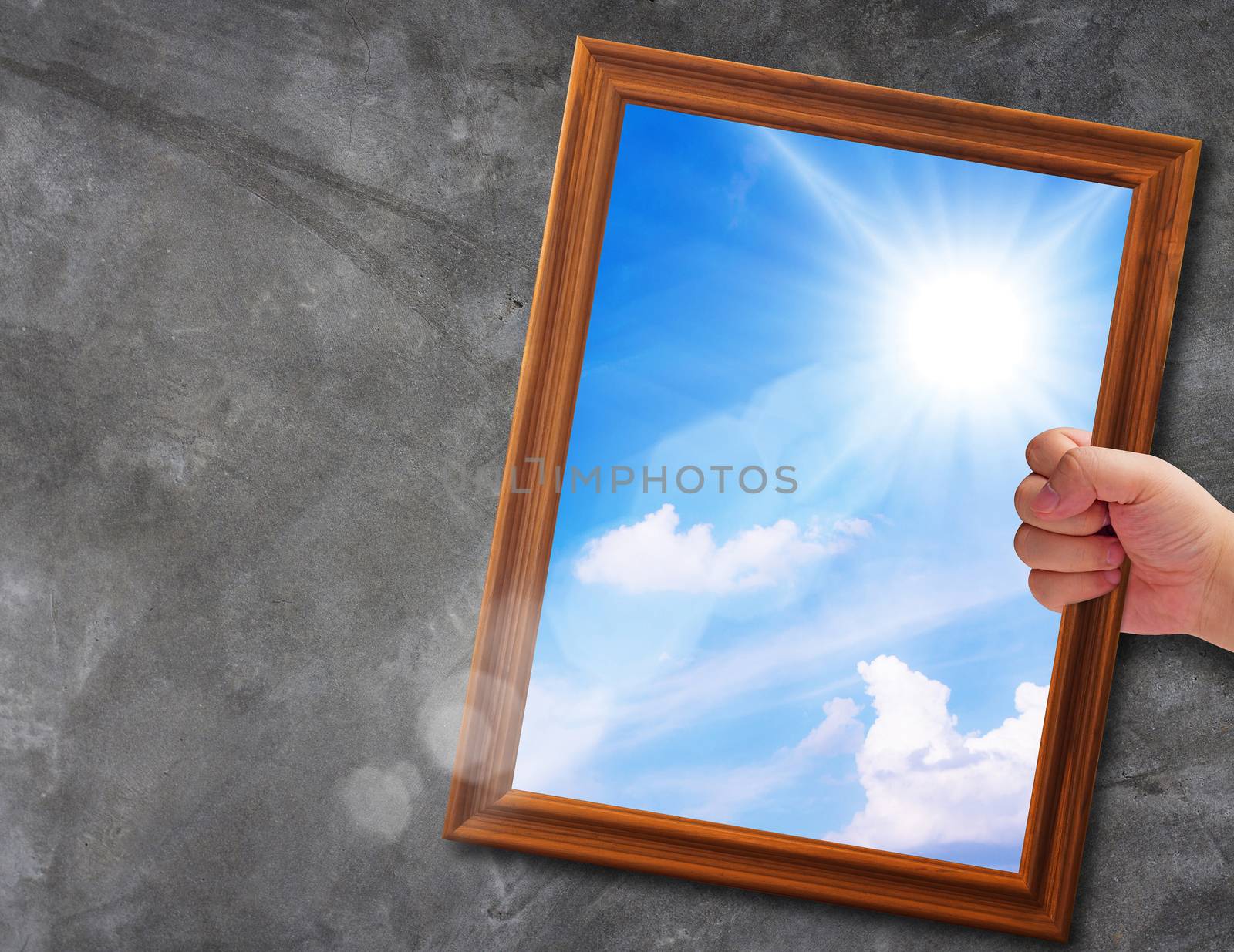 Business solution, problem concept, hand holding wooden frame way out to blue sky background