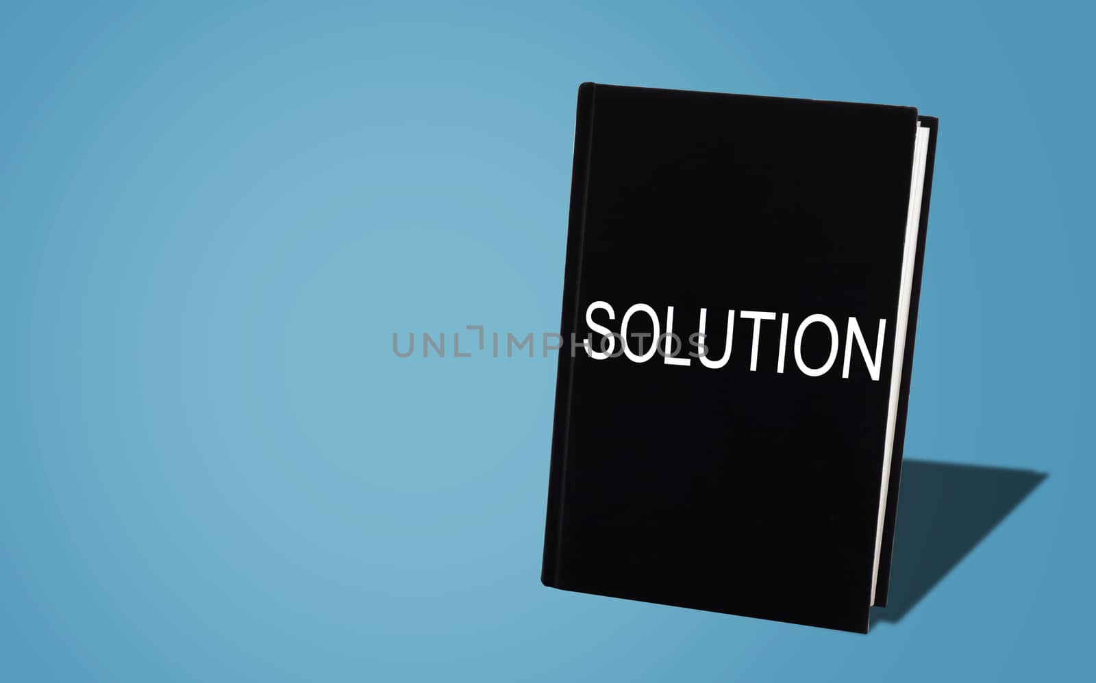 Business solution, solving problem, strategy and planning concept, black book on blue background