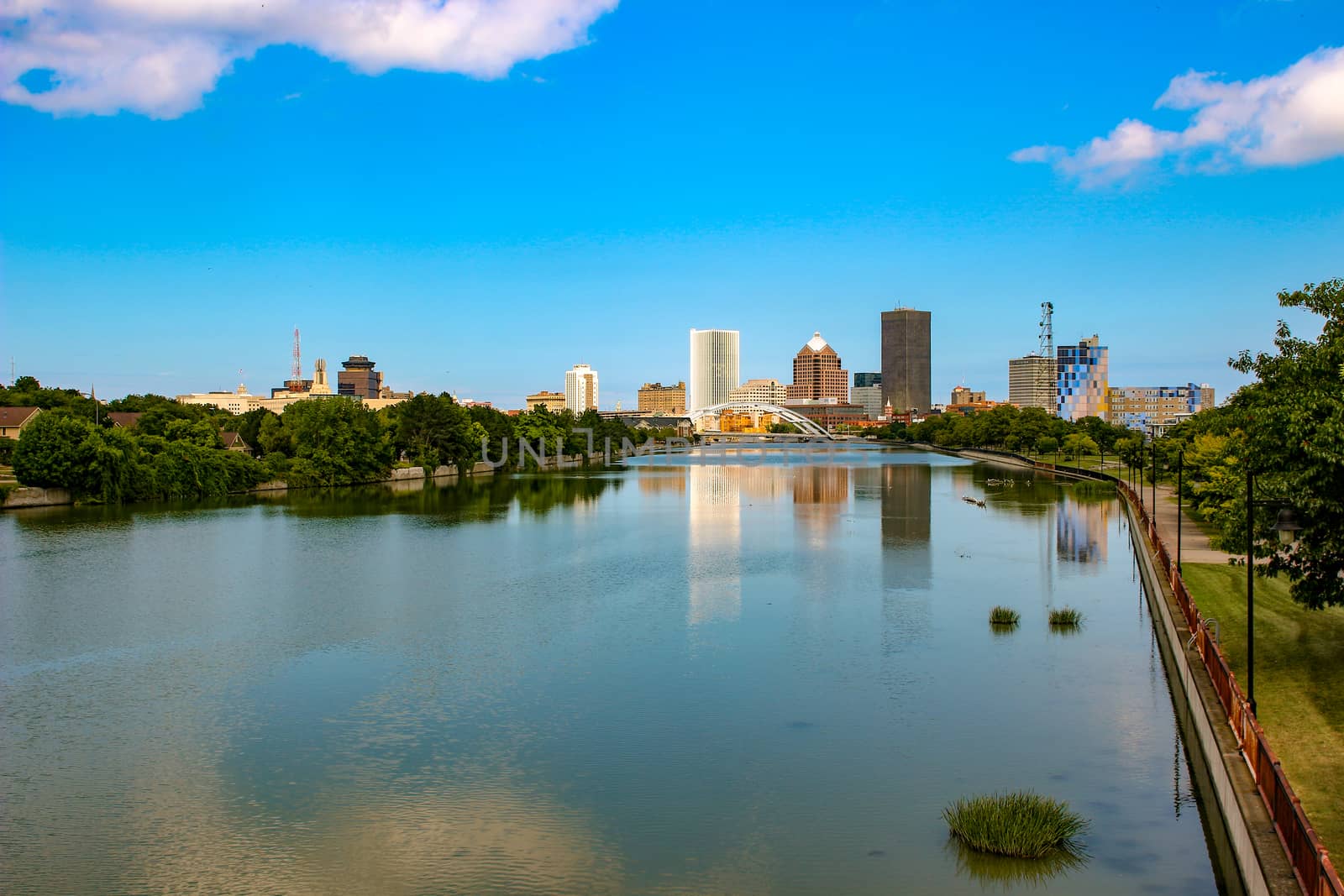 Skyline of Rochester, New York along Genesee River at sunset. by mynewturtle1