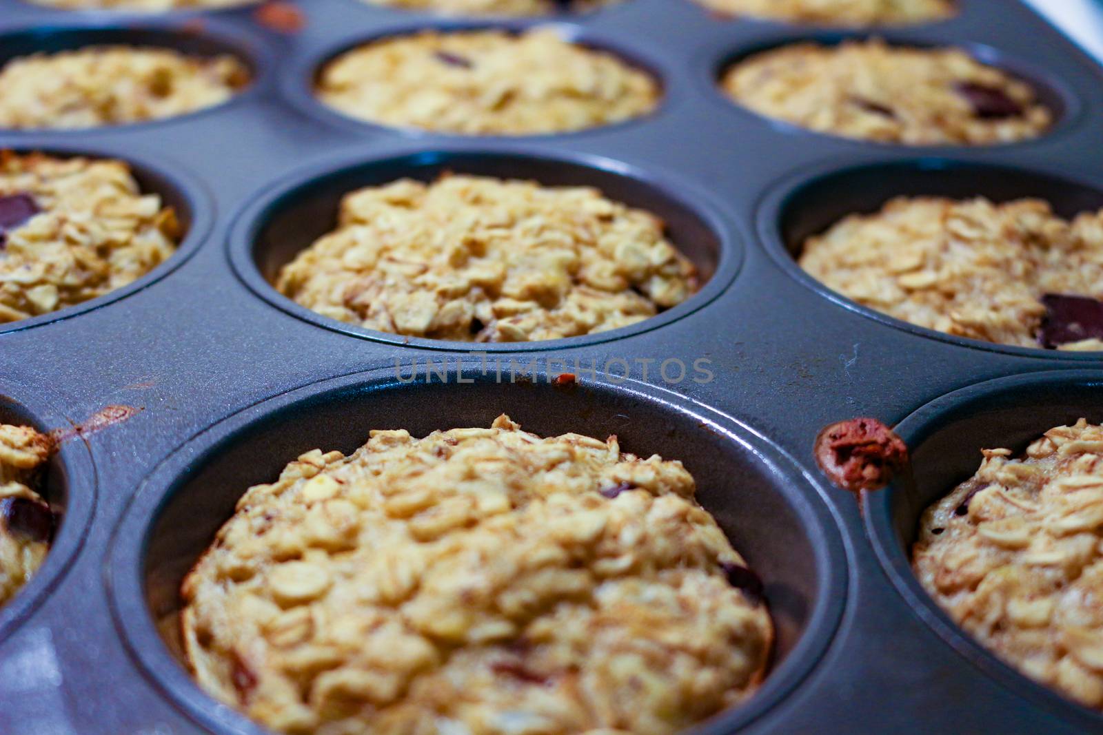 Homemade Breakfast Oatmeal Muffins in muffin tray ready