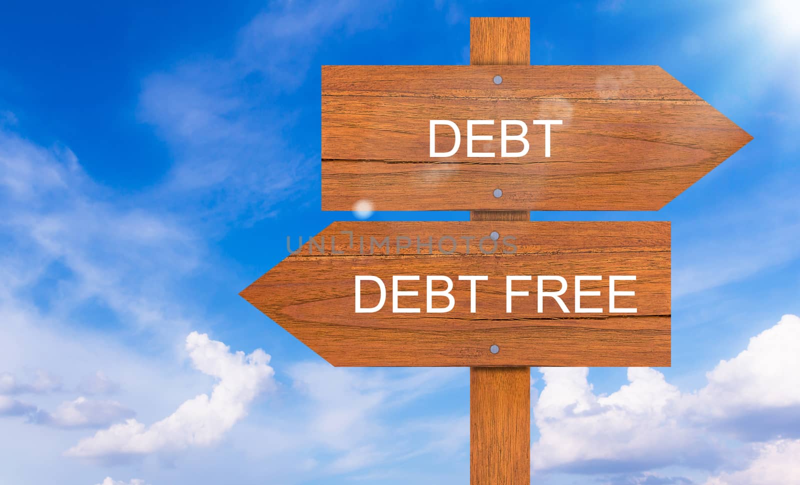 Debt, financial crisis concept, wood sign on blue sky background