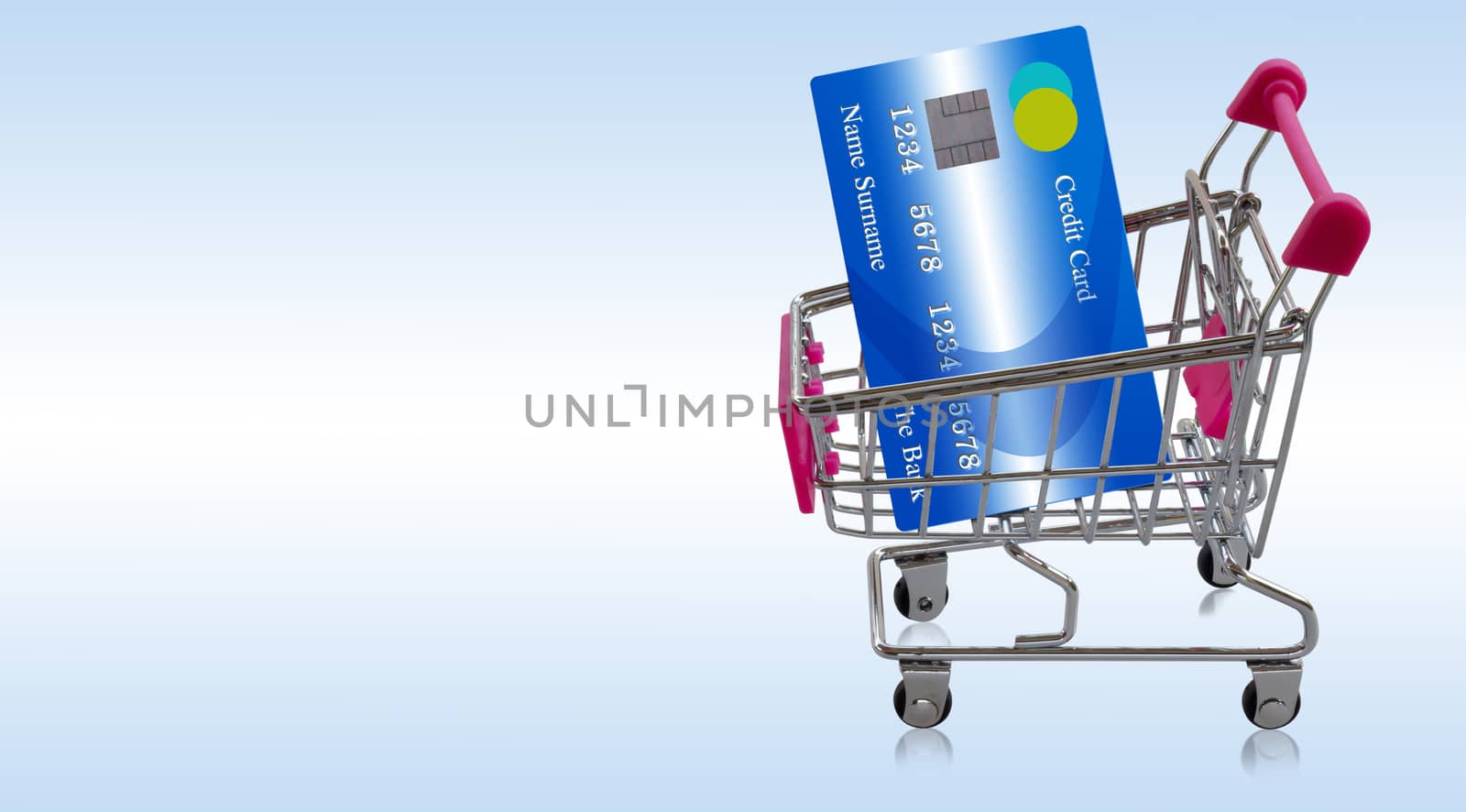 Credit card on shopping trolley or cart, online payment, electronic commerce financial concept  