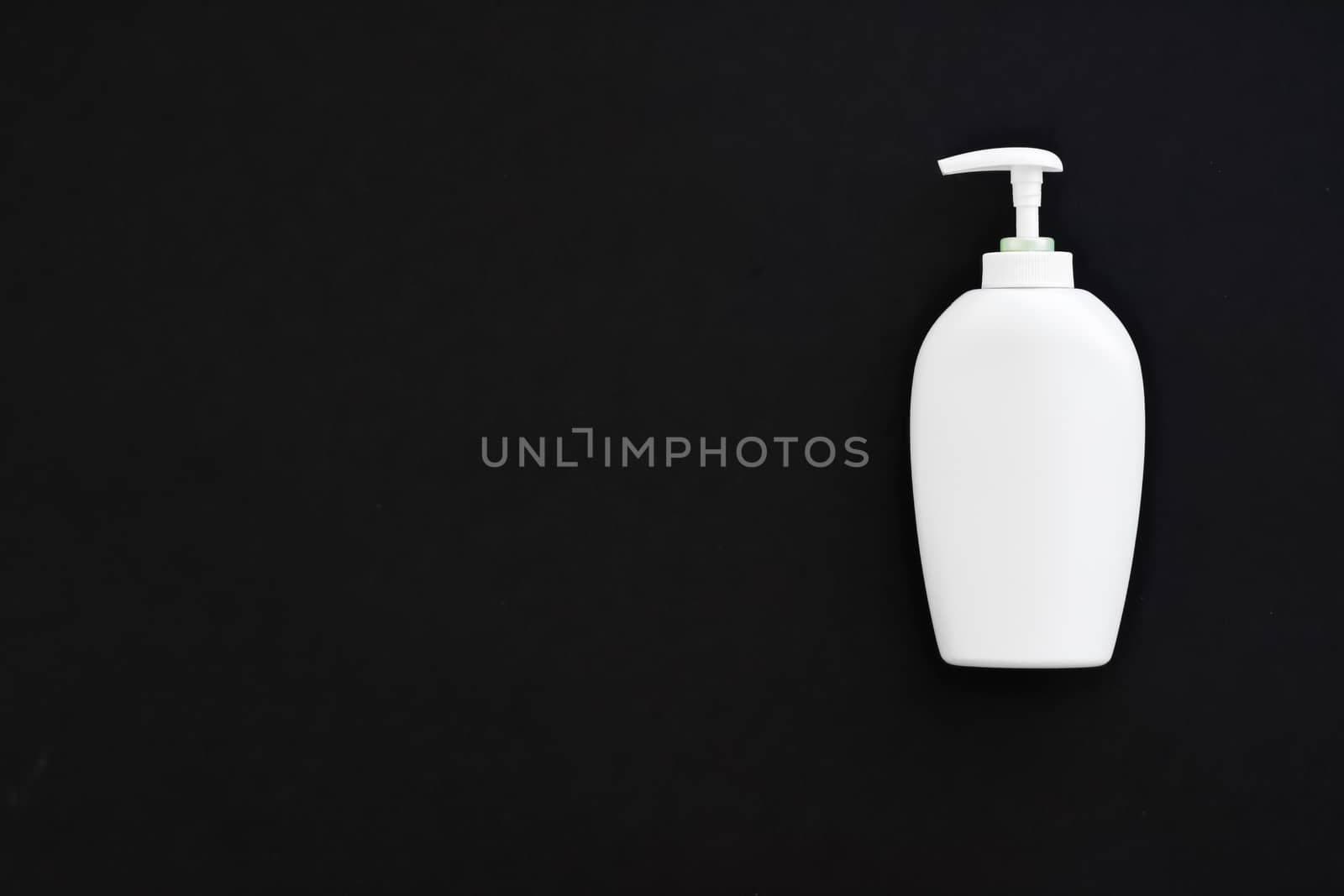 Blank label cosmetic container bottle as product mockup on black background by Anneleven