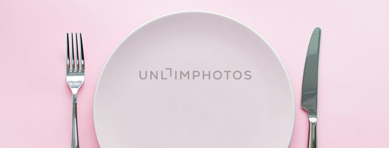 Empty plate and cutlery as mockup set on pink background, top tableware for chef table decor and menu branding design