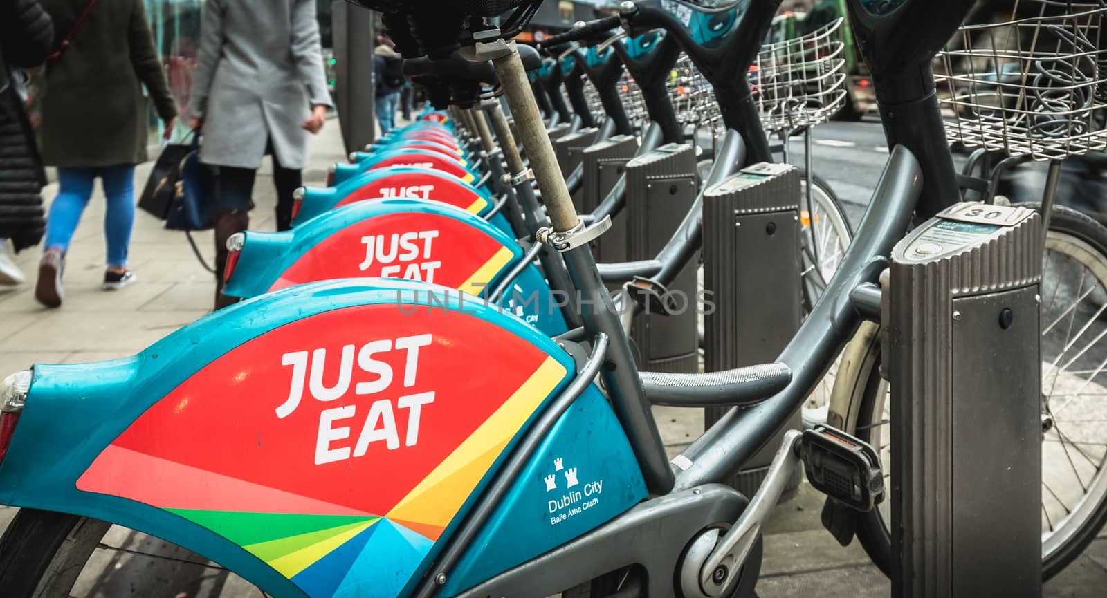Dublin, Ireland - February 11, 2019: Detail of a shared public bike station Just Eat dublinbikes in the city center on a winter day