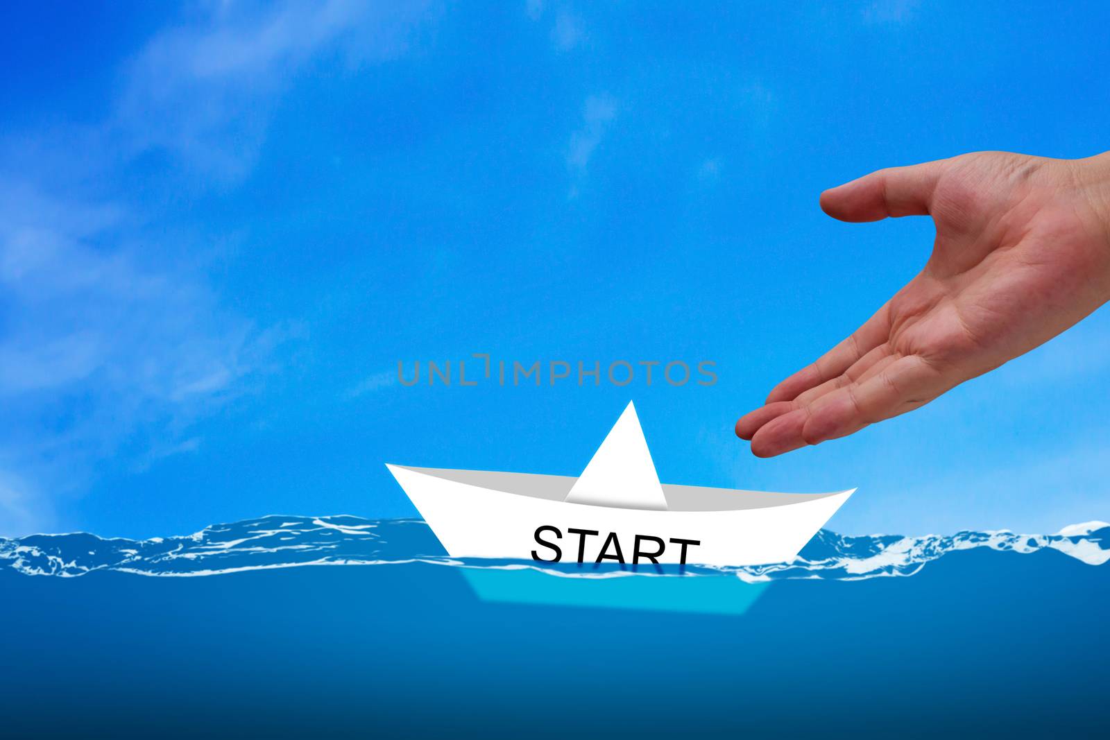 Business start concept, strategy and planning, road to success, hand and white boat paper on water background