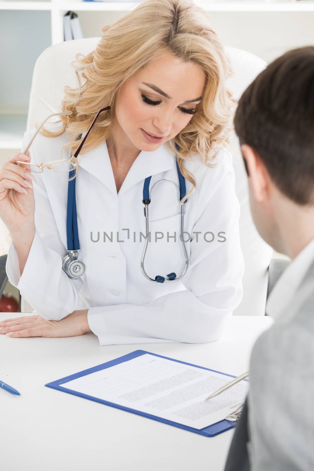 Female doctor and patient reading contract at pad. Physical agreement form signature, disease prevention, ward round reception, consent contract sign, prescribe remedy, healthy lifestyle concept