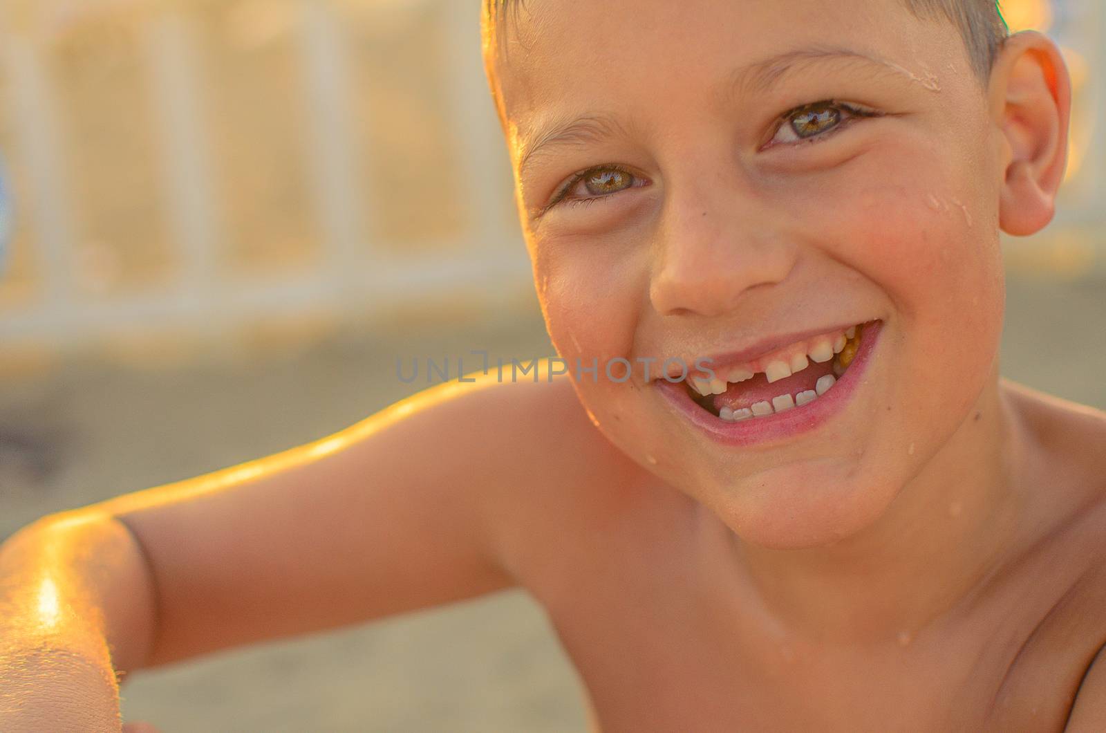 happy little boy on the beach on a sunny day