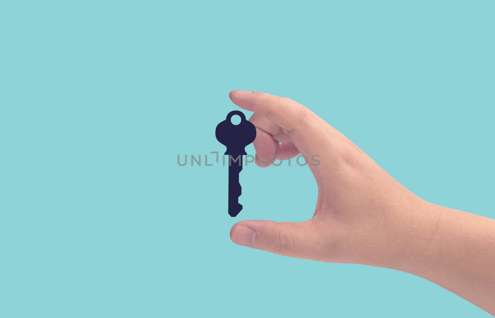 Business success concept, growth and achievement, hand holding the key