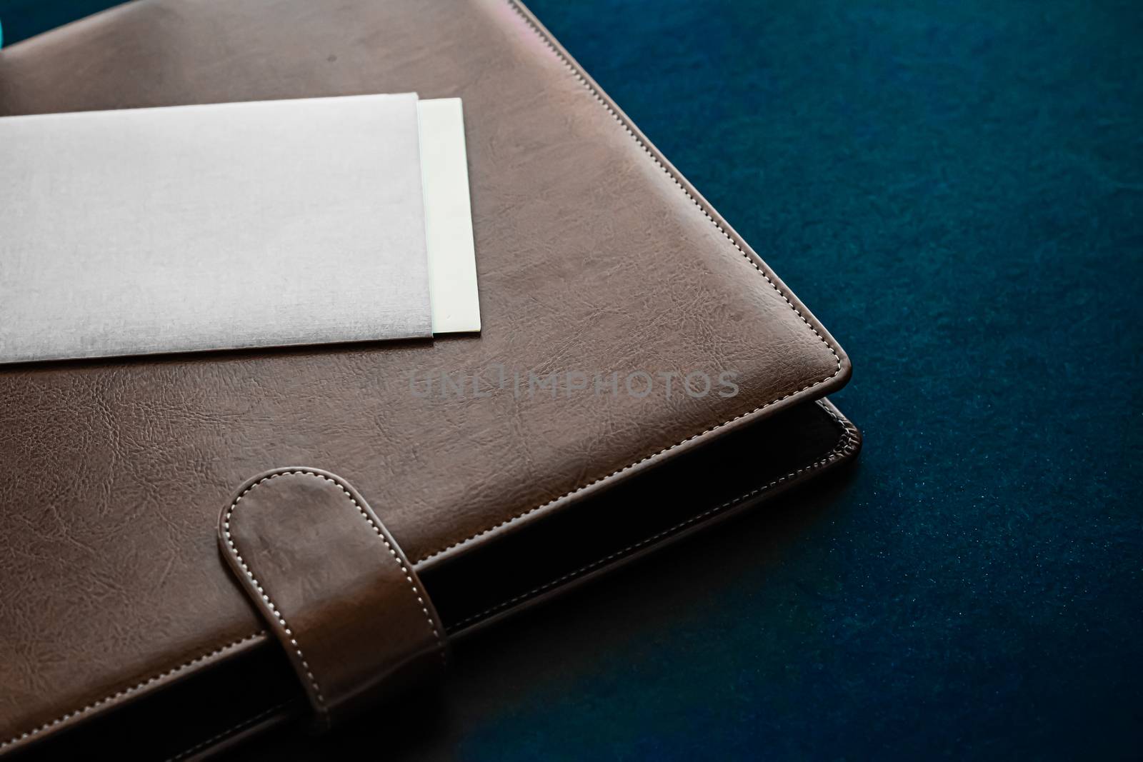 Office desk with briefcase and business card, finance and economy by Anneleven