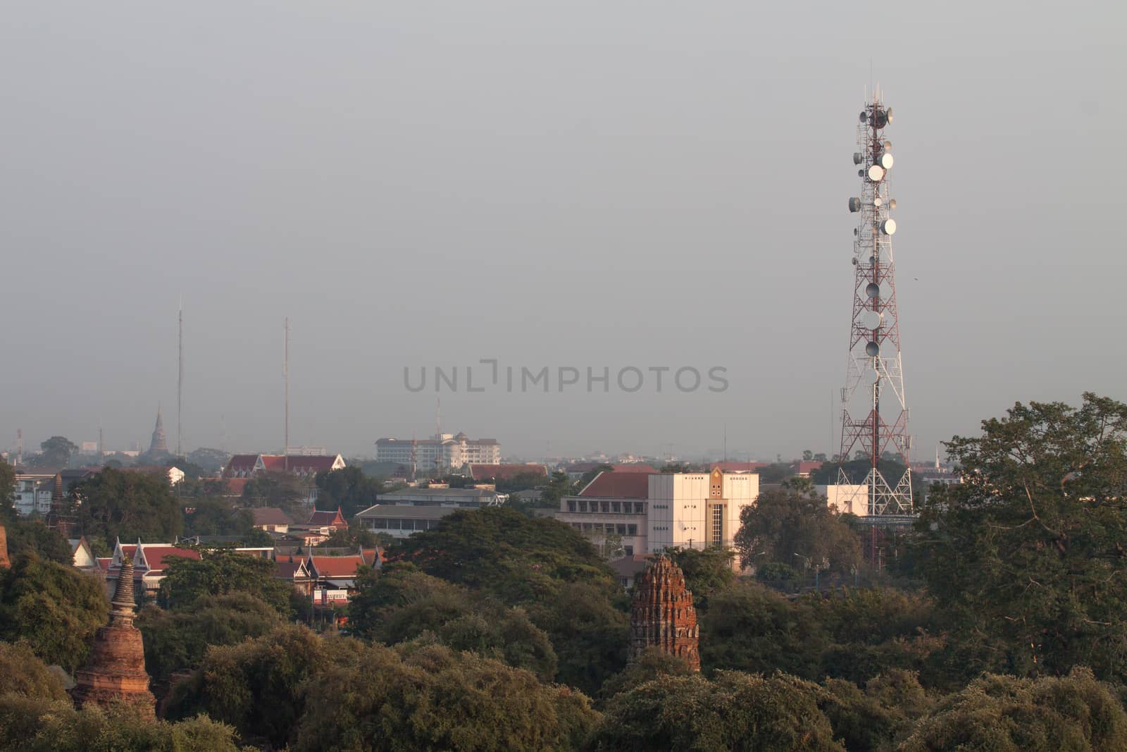 Telecommunication mobile antenna on roof building by thattep