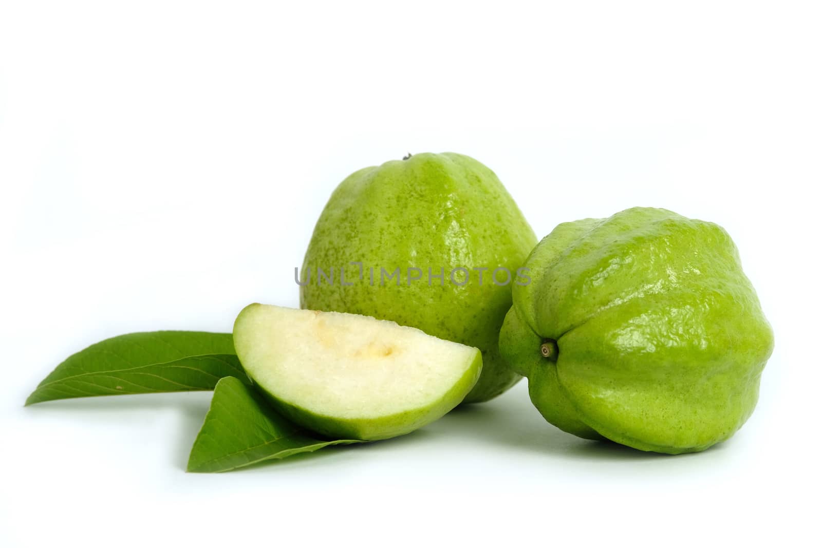 Green crystal guava raw fruit and sliced with leaves  isolated on a white background