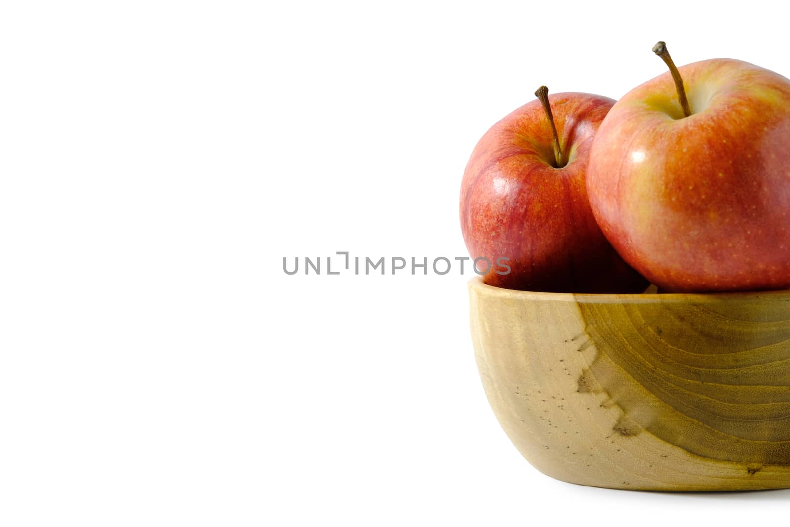 Group of red Apple above wooden bowl / basket isolated on white background