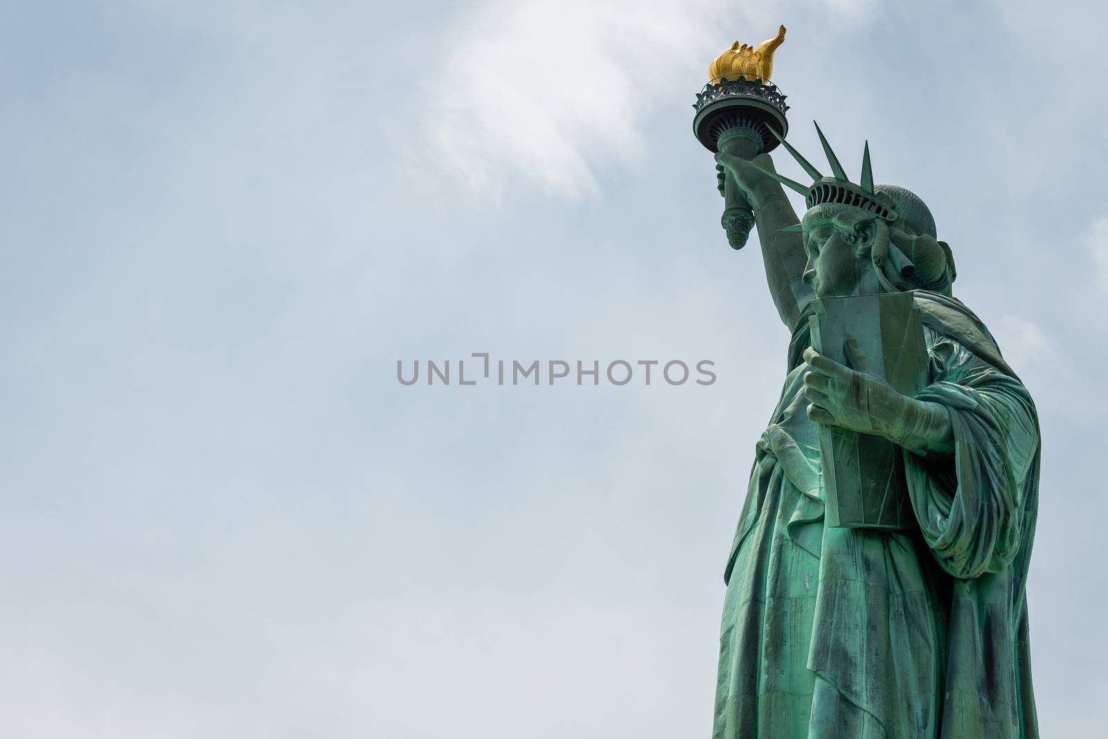 Statue of Liberty close up in a sunny day, blue sky in New York - Image