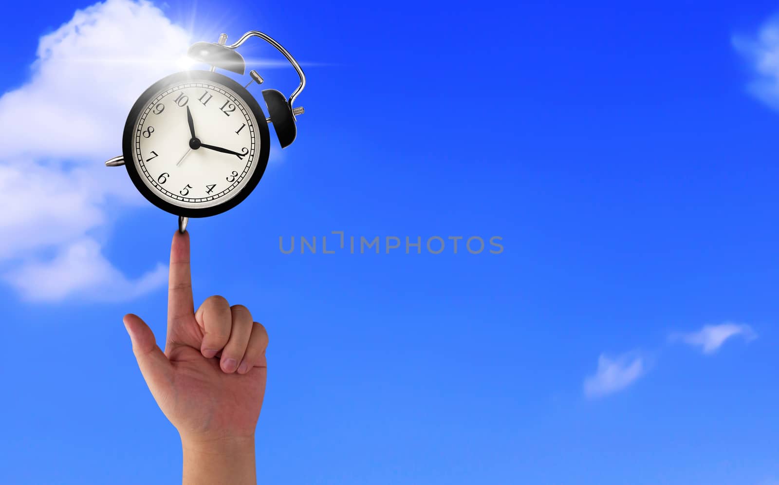 Time management concept, business planning, hand and alarm clock on blue sky with copy space