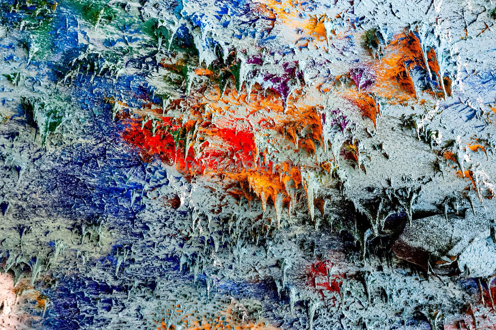 Colorful decorative ceiling plaster, reminiscent of multiple small slender stalactites - image