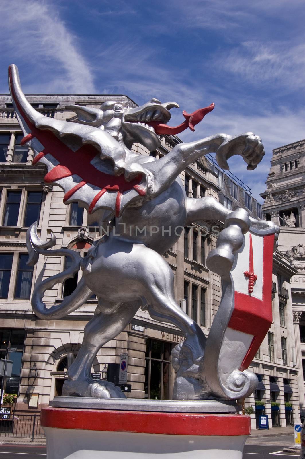 A dragon holding a shield of St George at one of the entrances to the City of London. Public monument on public display for over 50 years.