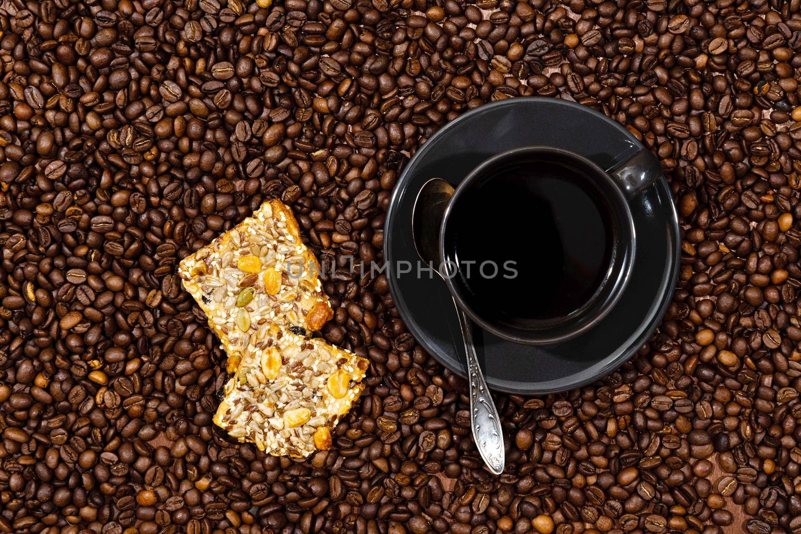 White coffee mug and cookies on the coffee beans background - image