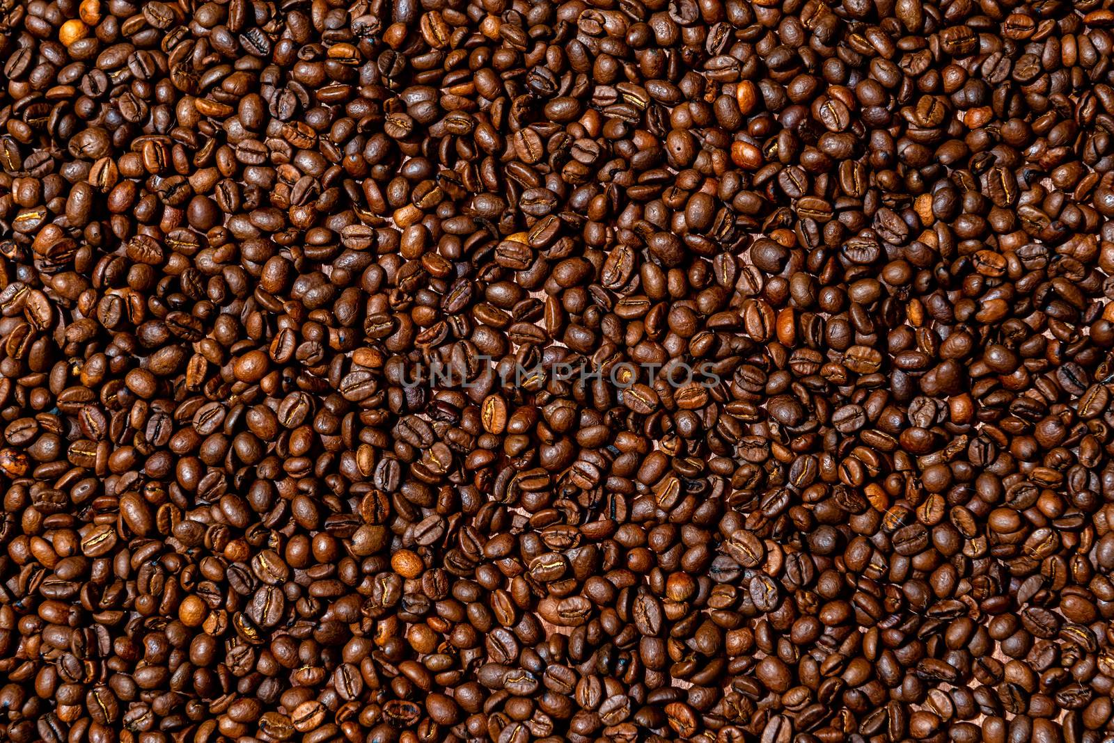 Close-up of brown, roasted coffee beans  background - image