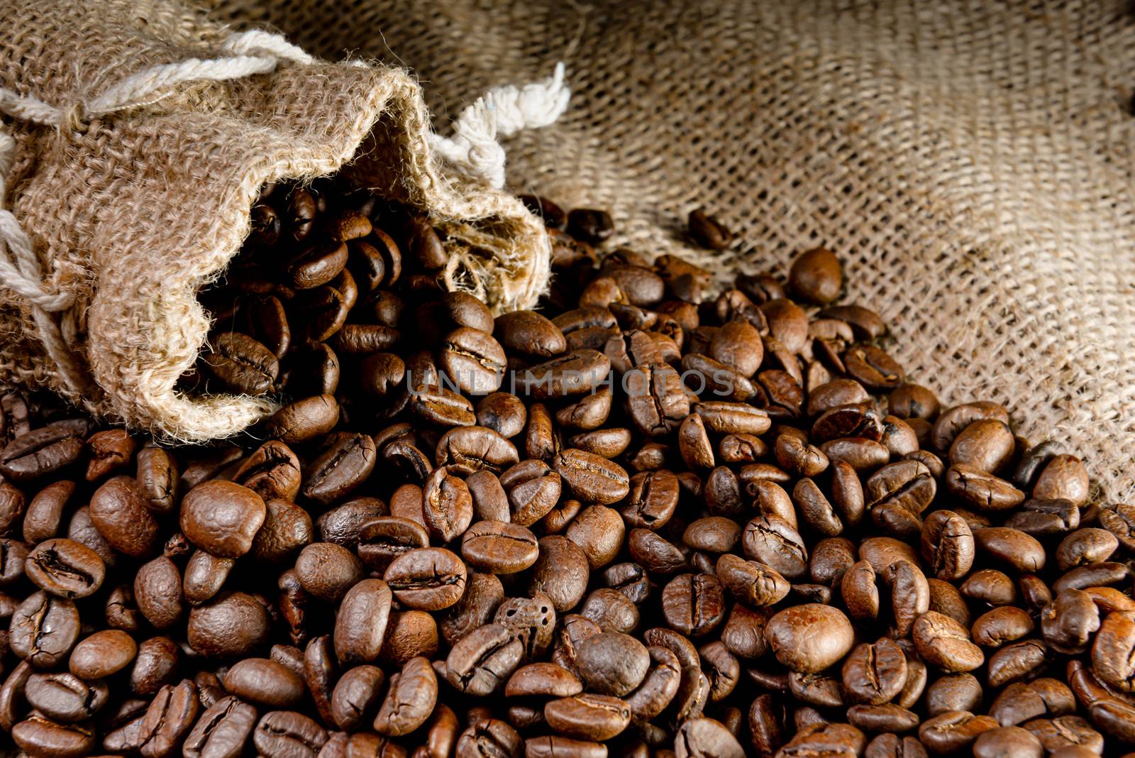 Coffee beans - coffee beans in a linen bag - selective focus - image