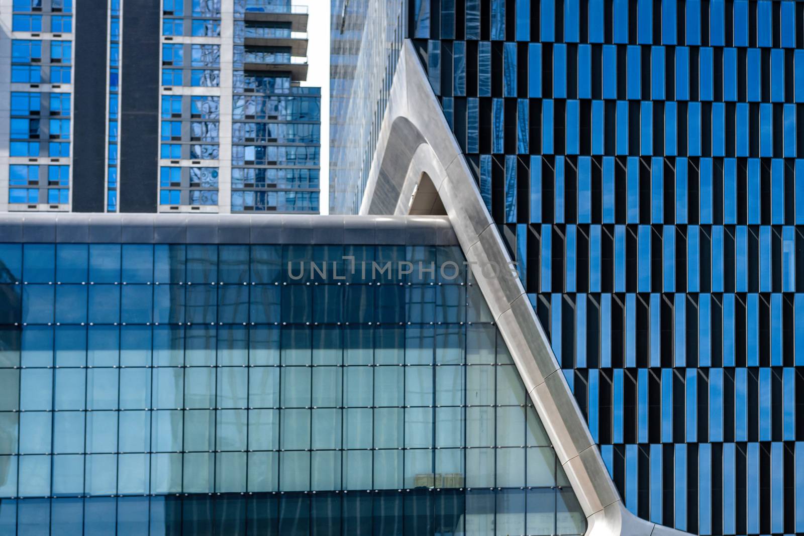 close-up of glass office building facade with windows, texture, architecture