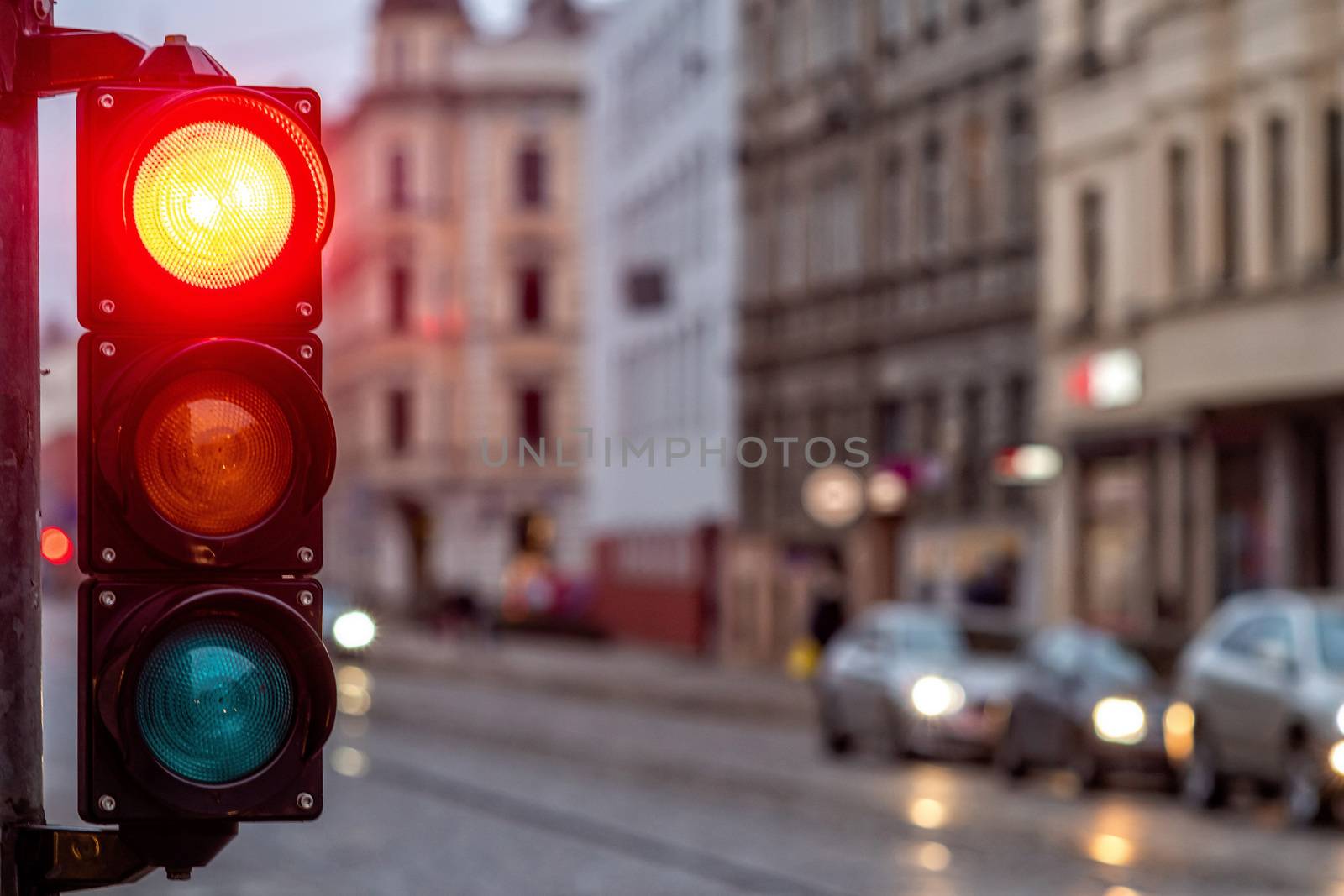 A city crossing with a semaphore. Red light in semaphore - image