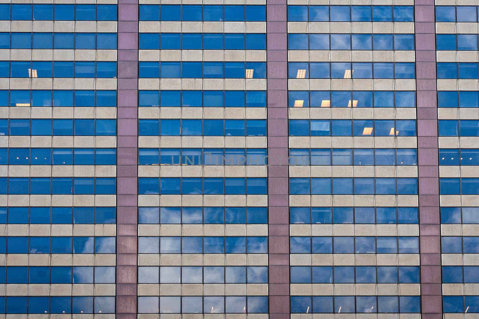 close-up of glass office building facade with windows, texture, architecture