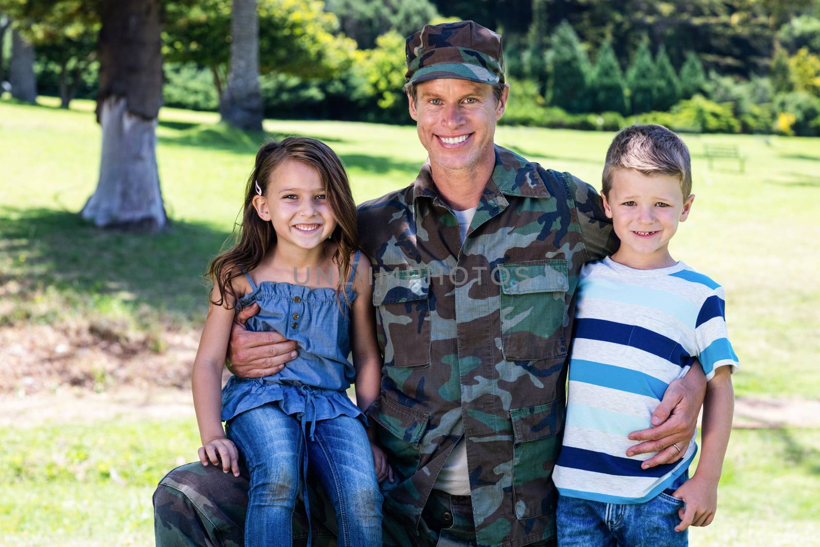 Happy soldier reunited with his son and daughter by Wavebreakmedia