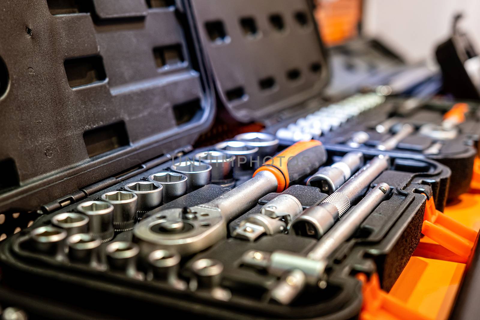 Box with special tools in car repair shop, closeup - image