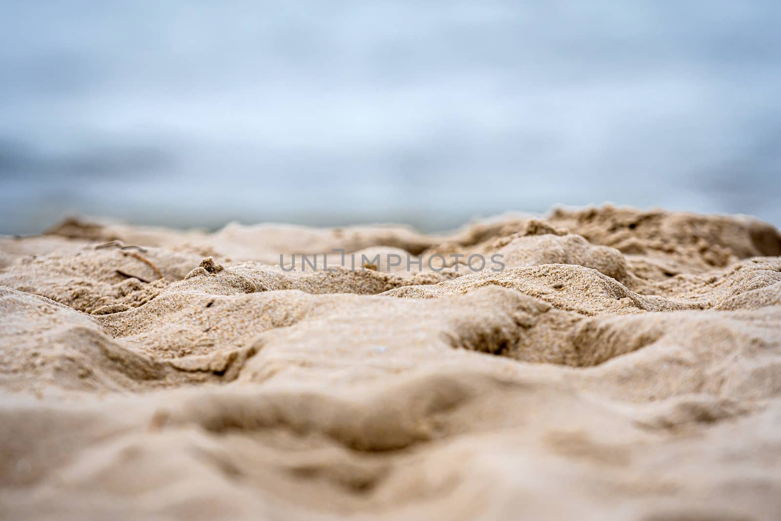 close-up of white sand on the ocean coast, summer vacation concept with space for text