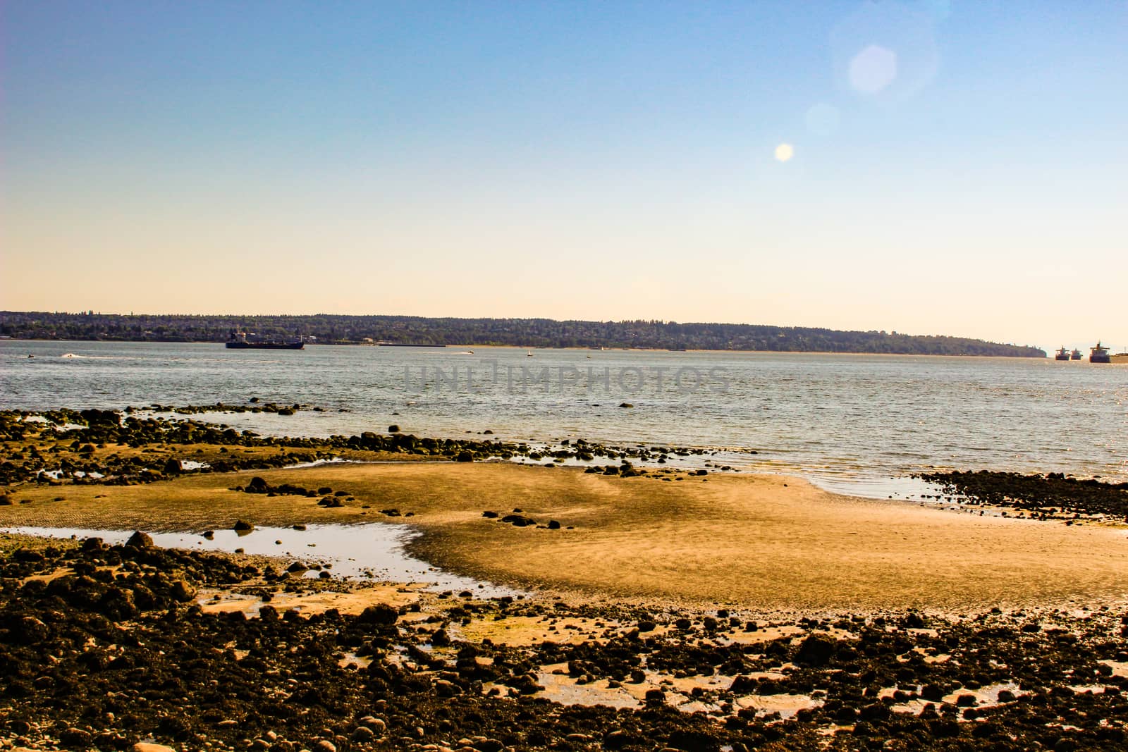 Third Beach - Vancouver, Canada. Third beach along Stanley Park in Vancouver, Canada. View of the North Shore by mynewturtle1