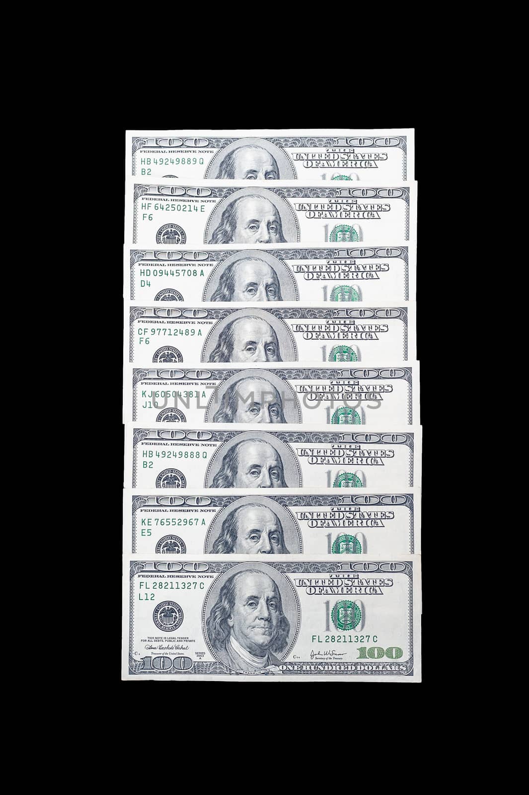 stacked in a row 100 US dollar bills with a portrait of American President Benjamin Franklin on an isolated black background