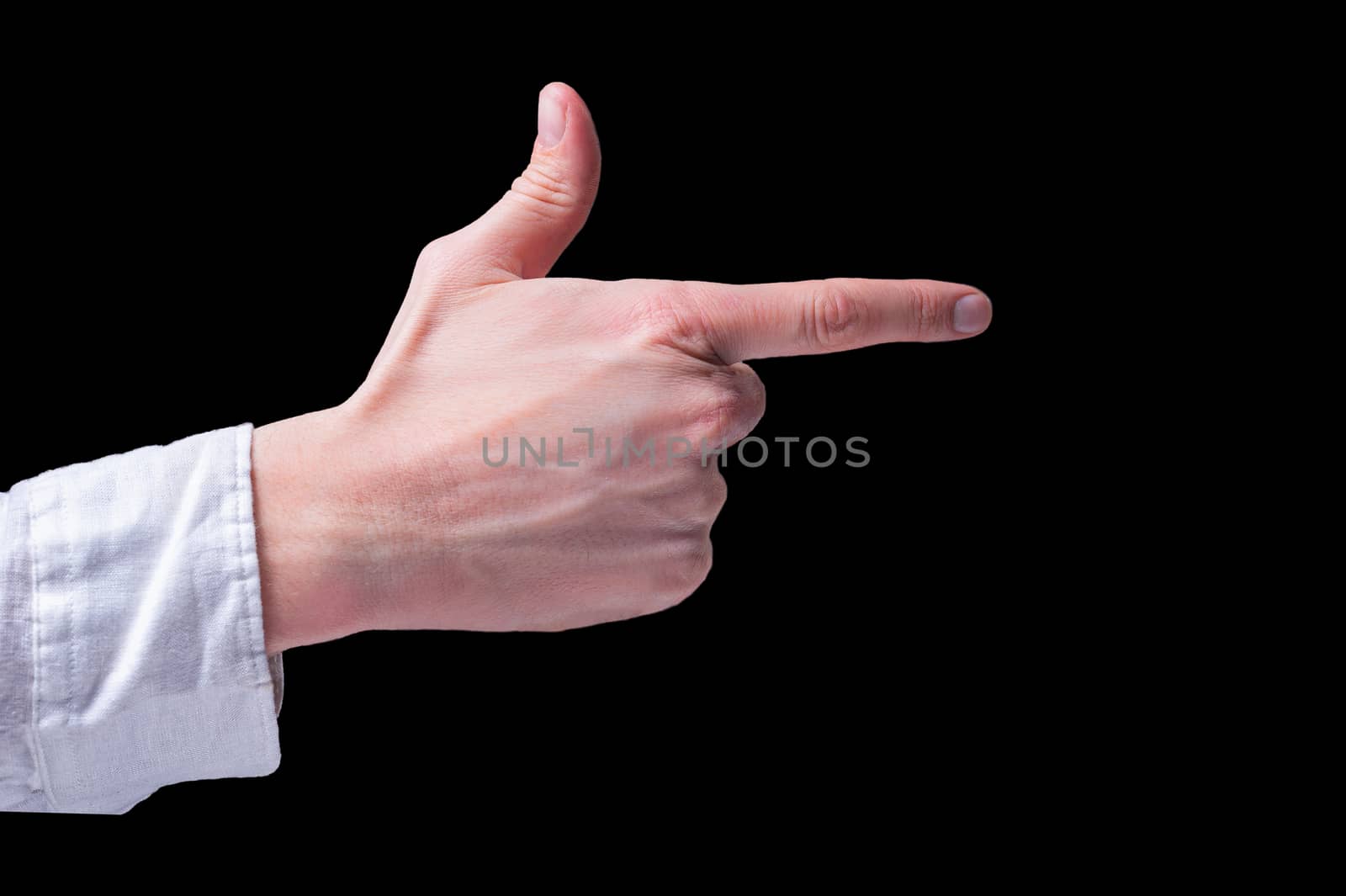 Human hand in a white shirt shows the finger gun sigh on isolated black background
