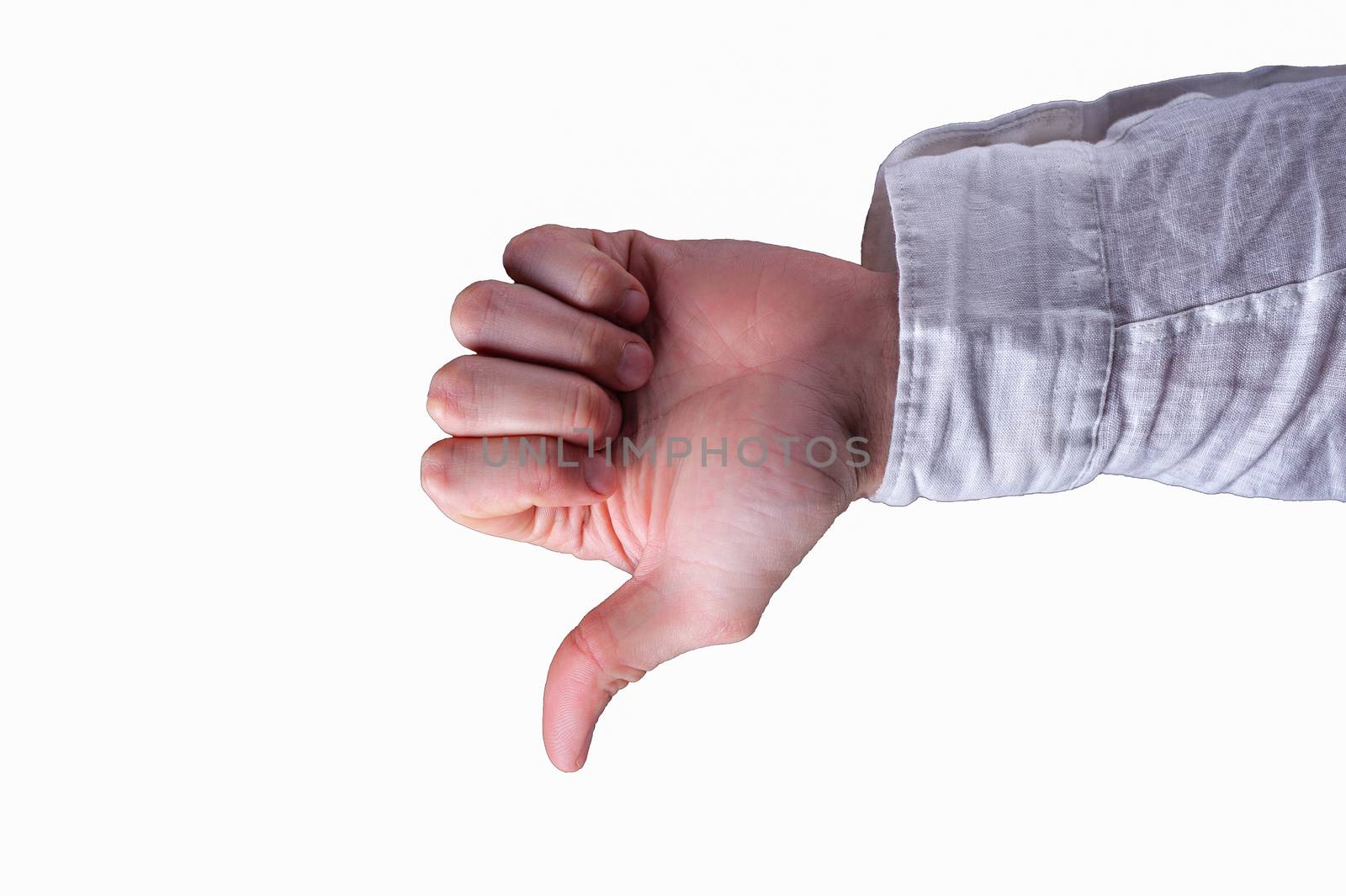 Hand of a man in a white shirt shows thumbs-down sign on isolated white background